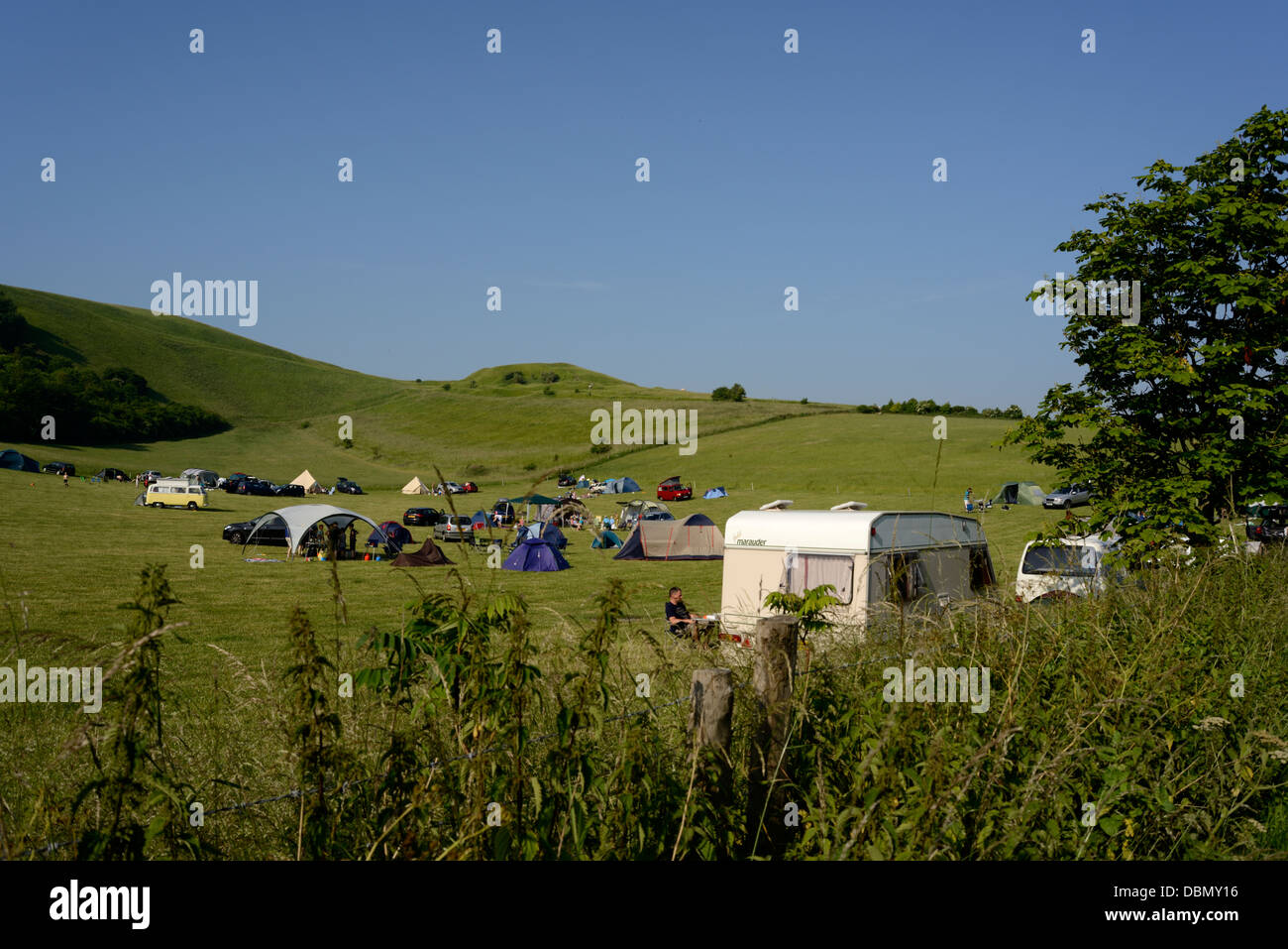 Campers on a campsite near Uffington Castle, Oxfordshire,England,UK Stock Photo