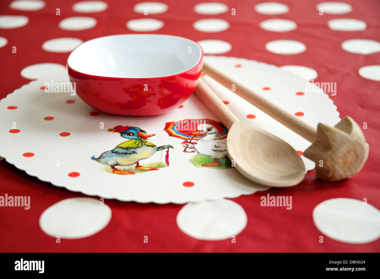 Wooden spoons on place mat, Munich, Bavaria, Germany Stock Photo