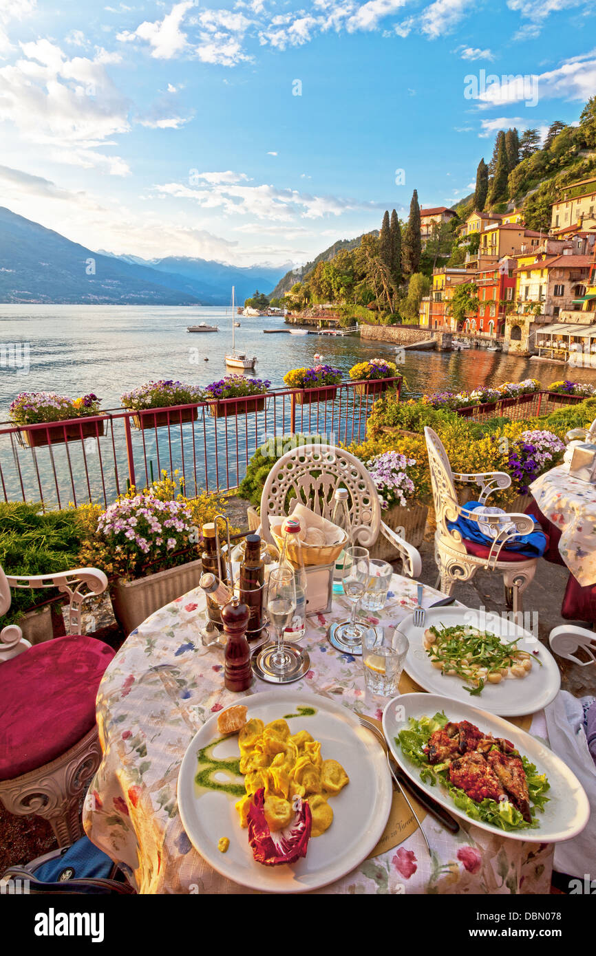 Romantic, beautiful dinner setting at Italian lake Como in the early