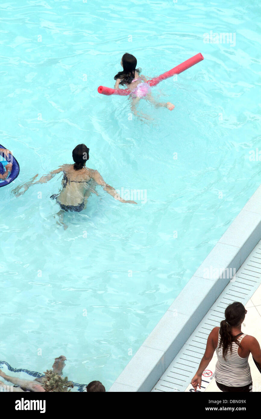 Suri Cruise and her mother Katie Holmes swimming and playing games in