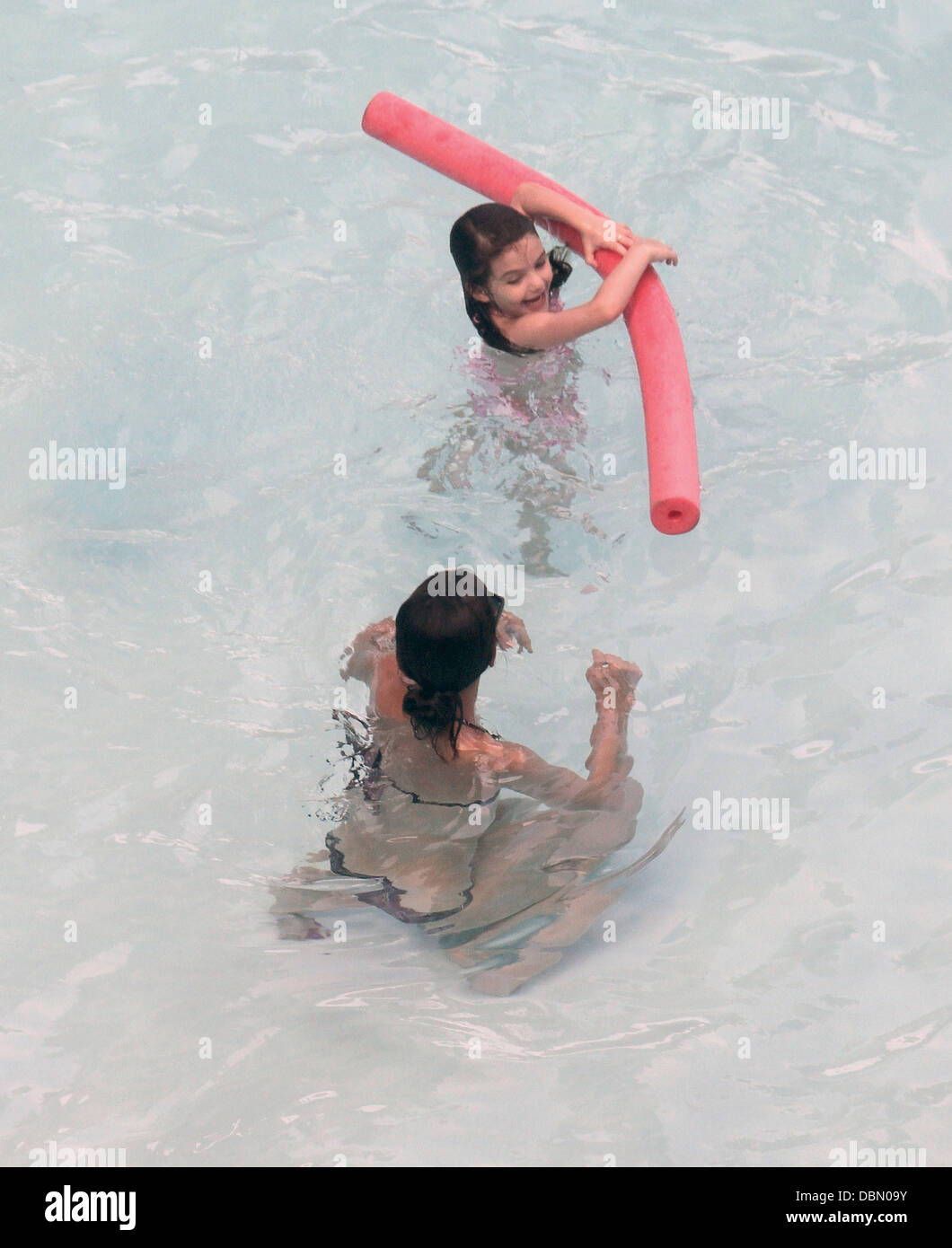 Suri Cruise and her mother Katie Holmes swimming and playing games in