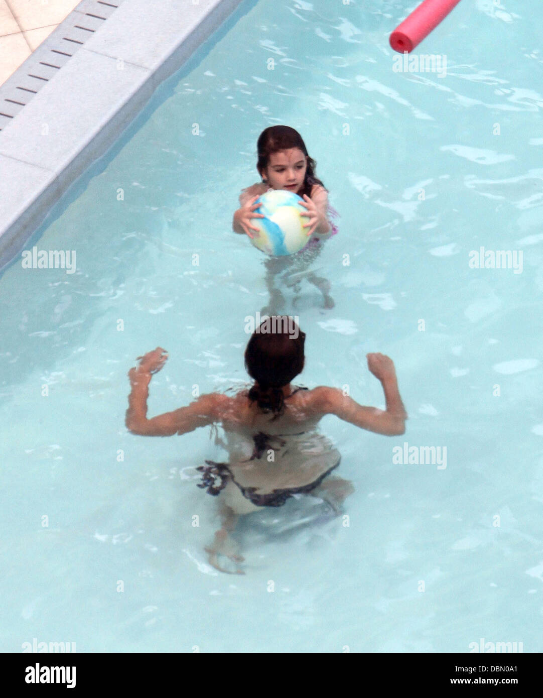 Suri Cruise and her mother Katie Holmes swimming and playing games in