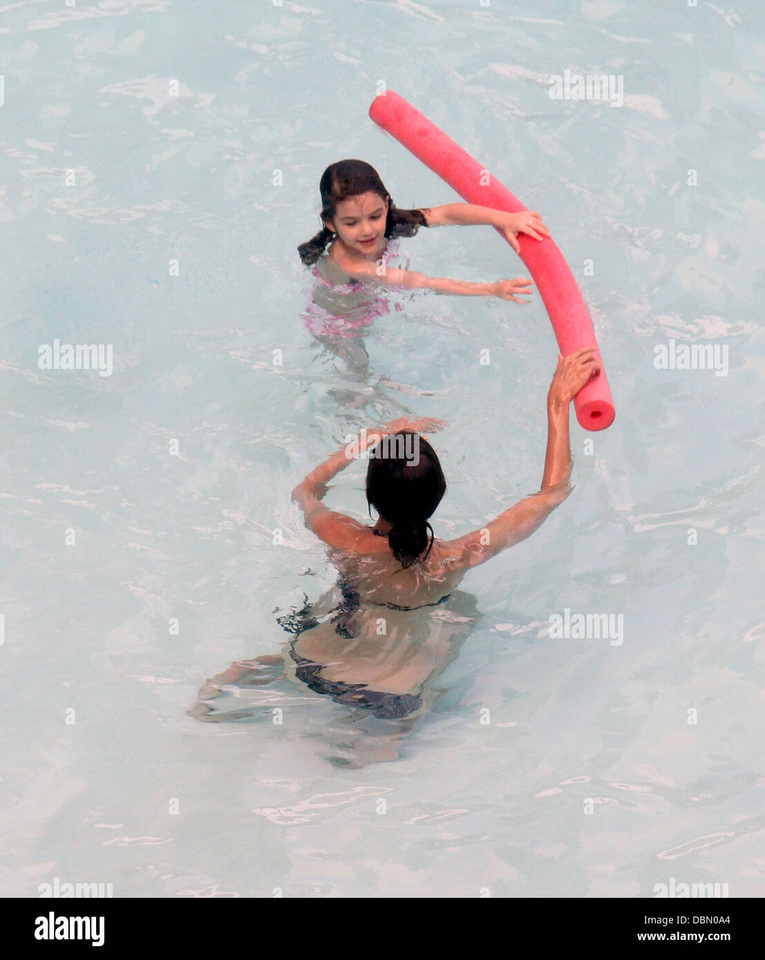 Suri Cruise and her mother Katie Holmes swimming and playing games in