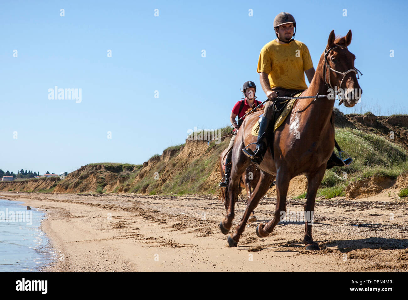 Couple On Beach Riding Horses, Croatia, Dalmatia, Europe Stock Photo