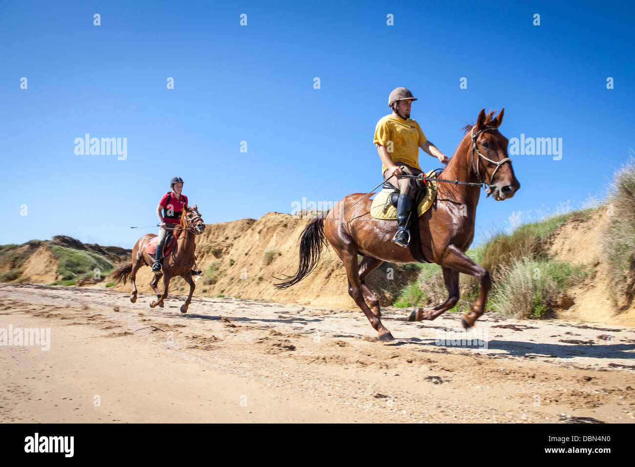 Couple On Sandy Beach Riding Horses, Croatia, Dalmatia, Europe Stock Photo