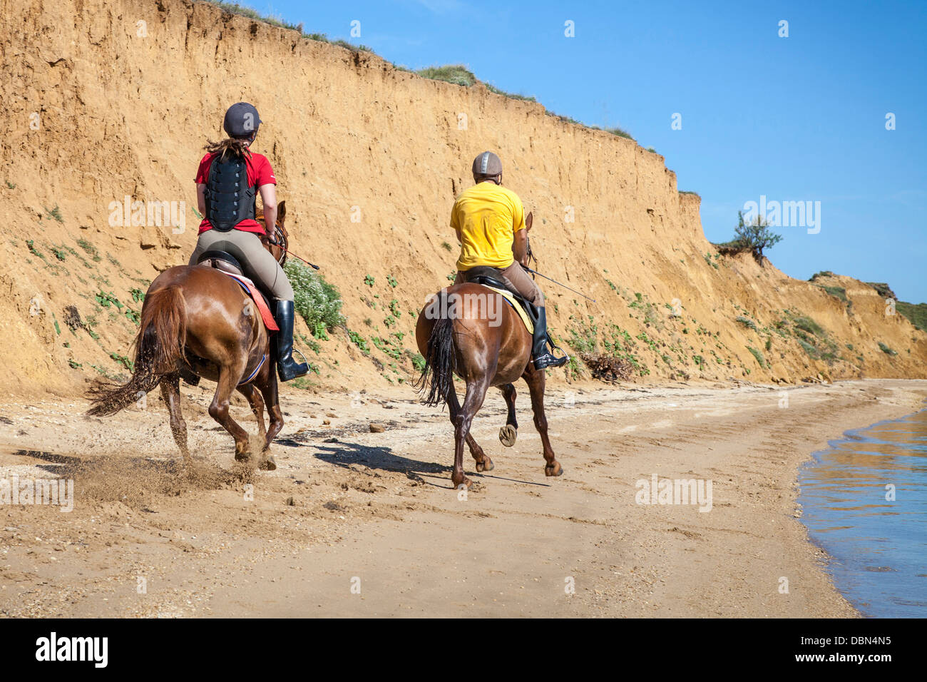 Couple On Sandy Beach Riding Horses, Croatia, Dalmatia, Europe Stock Photo