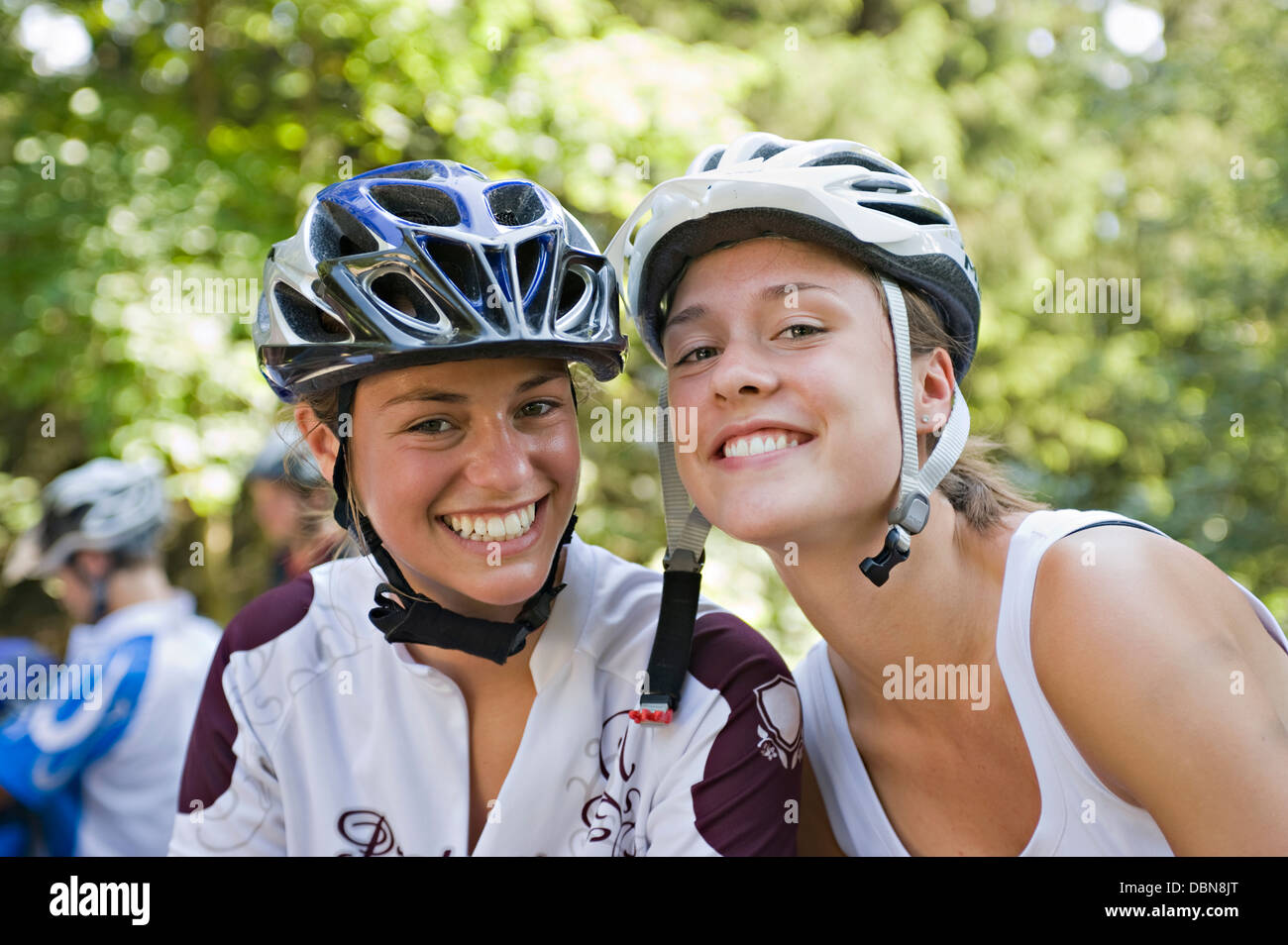Two Teenage Girls Wearing Bicycle Helmets, Sonthofen, Schattwald, Bavaria, Germany Stock Photo