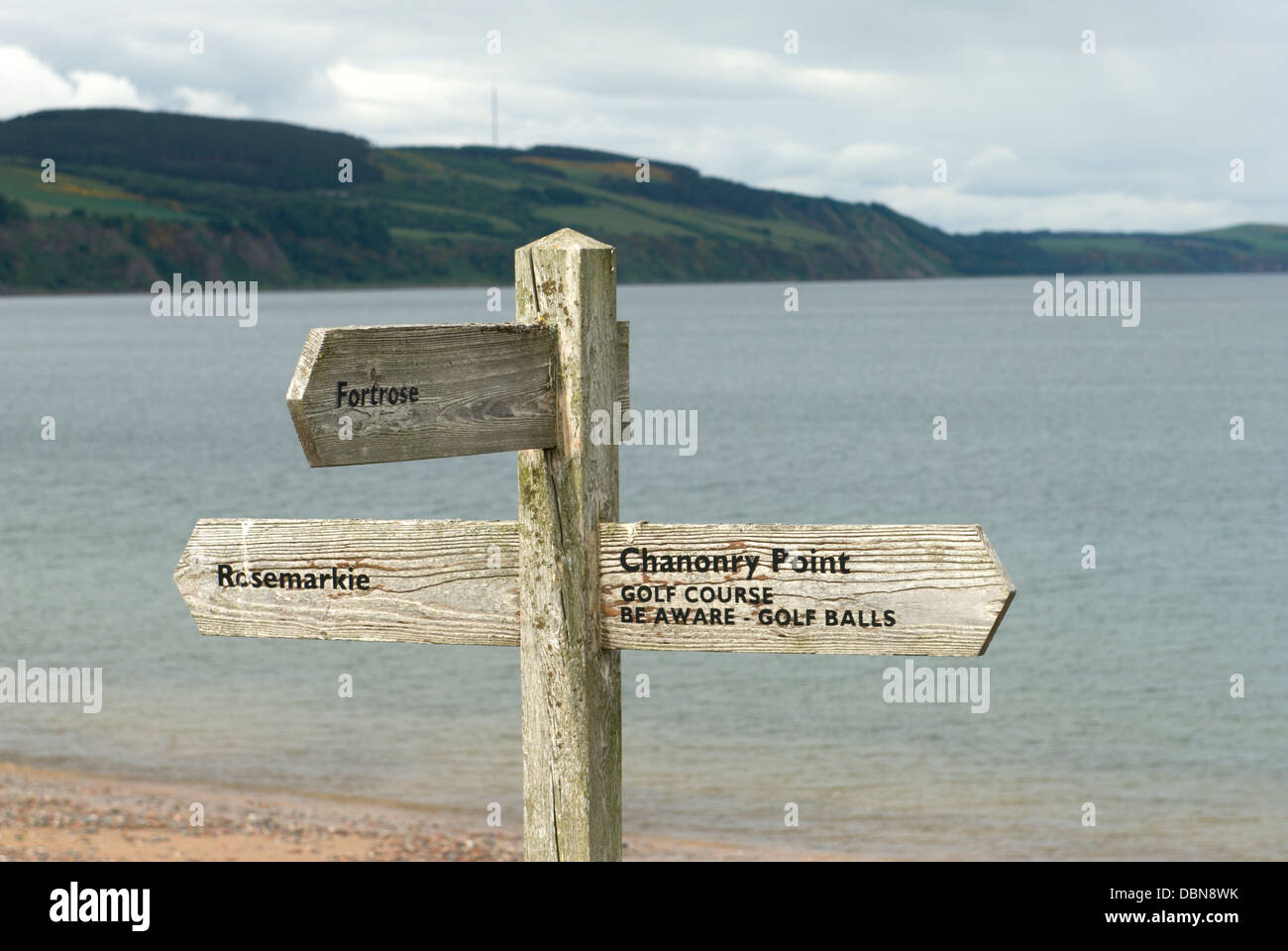 Wooden signpost on the coast near Rosemarkie on the Black Isle in north east Scotland Stock Photo