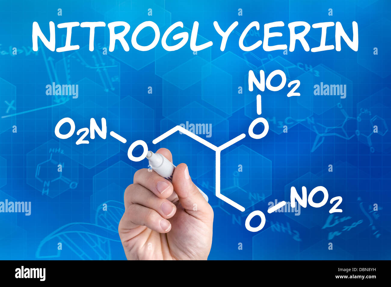 hand with pen drawing the chemical formula of nitroglycerin Stock Photo