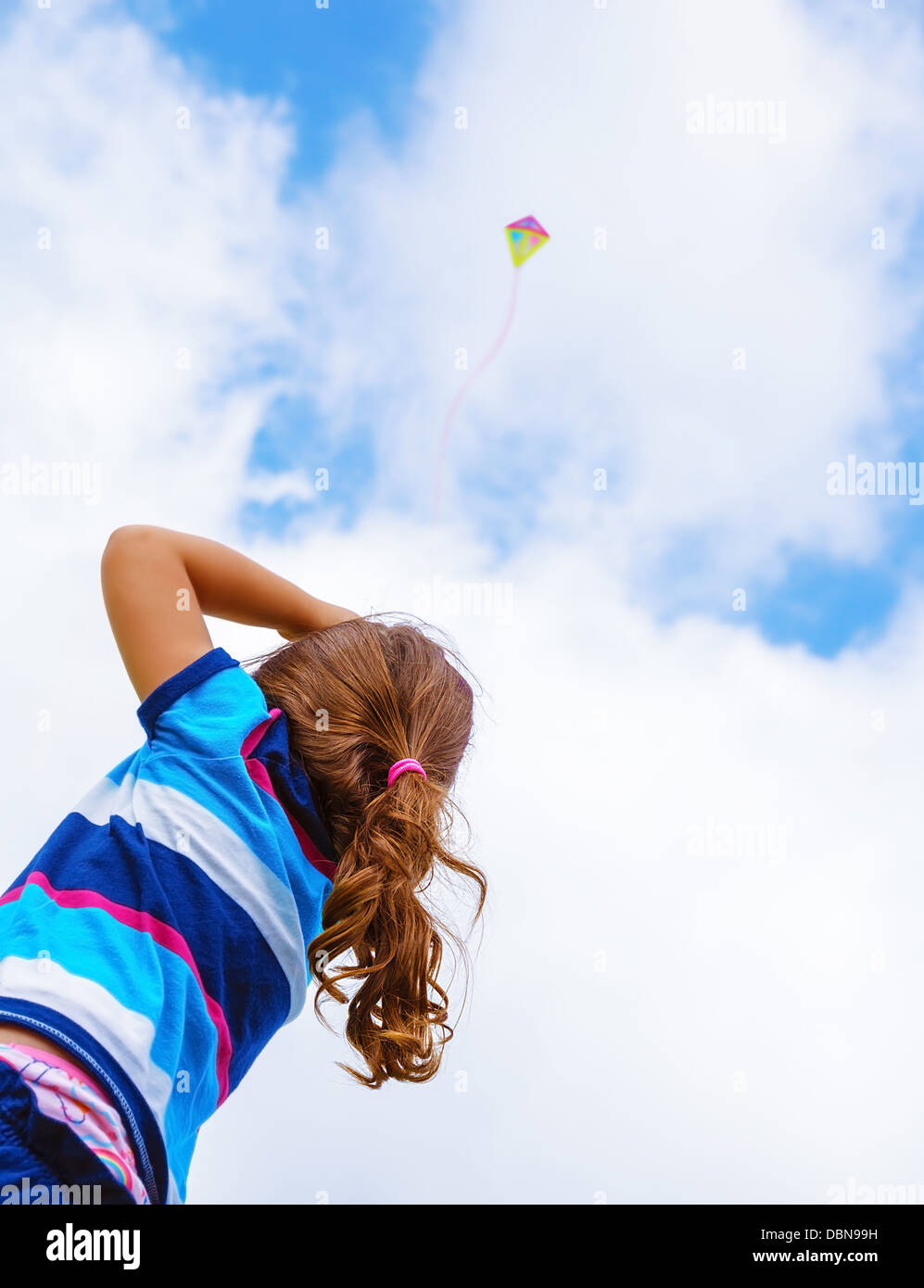 Little Girl Looking Up At The Sky