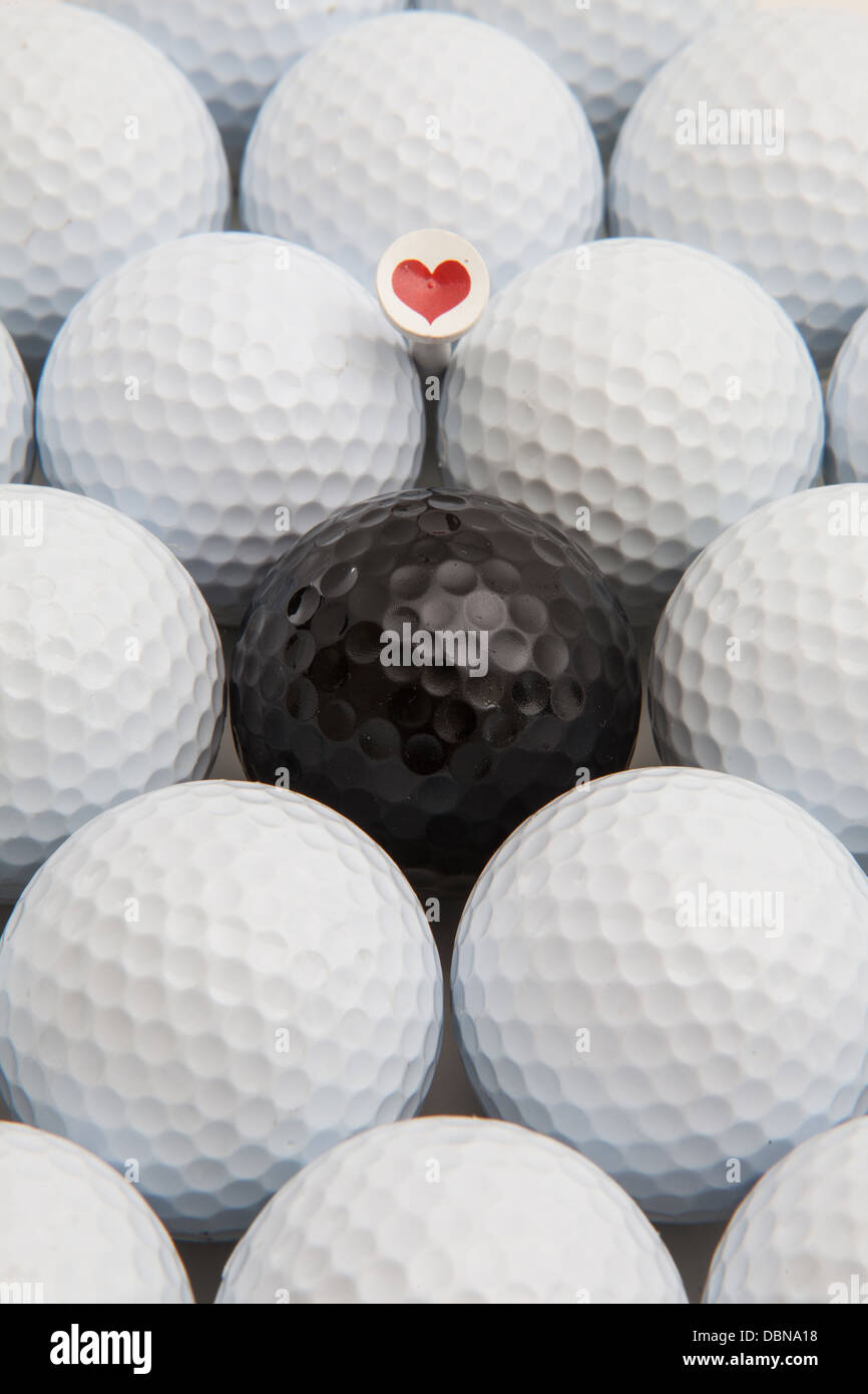 Different golf balls and romantic wooden tee Stock Photo Alamy