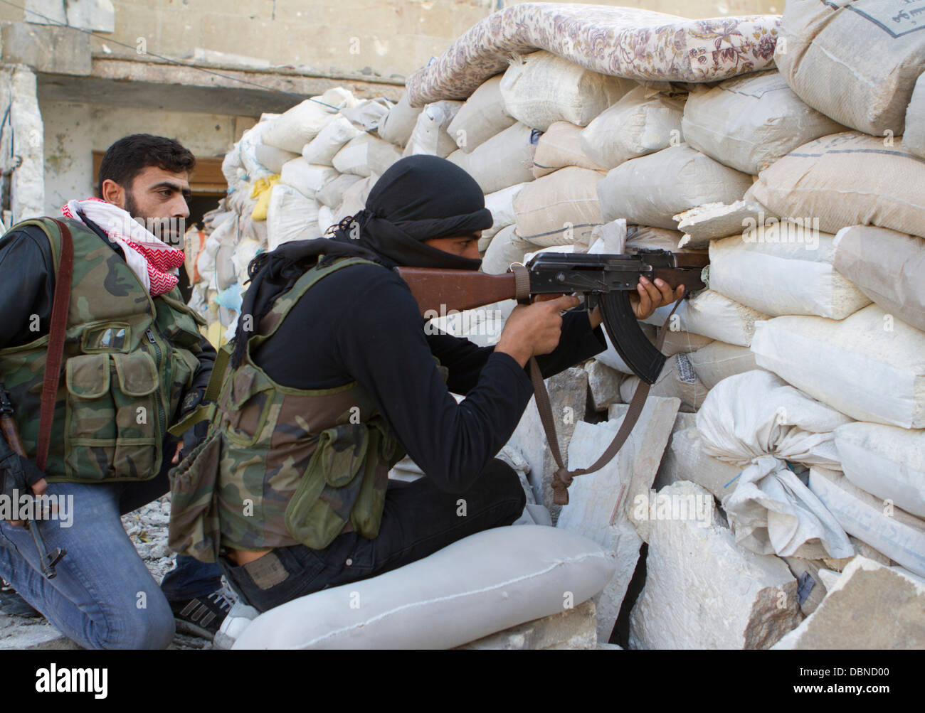 November 1, 2012 - Aleppo, Syria: Free Syrian Army fighters take aim at the enemy. Stock Photo