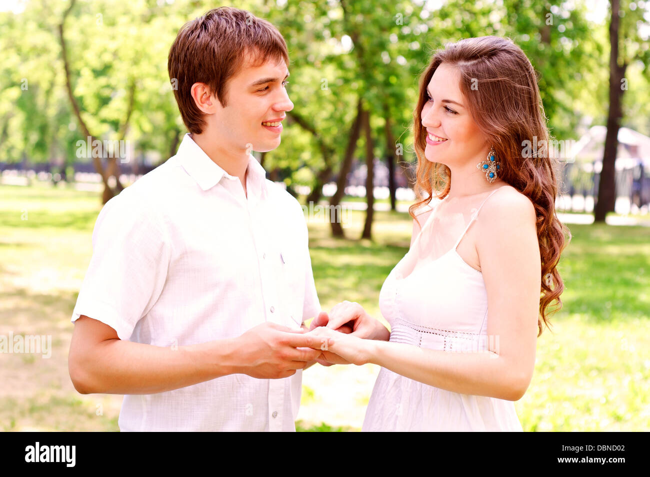 couple holding hands in the park Stock Photo - Alamy