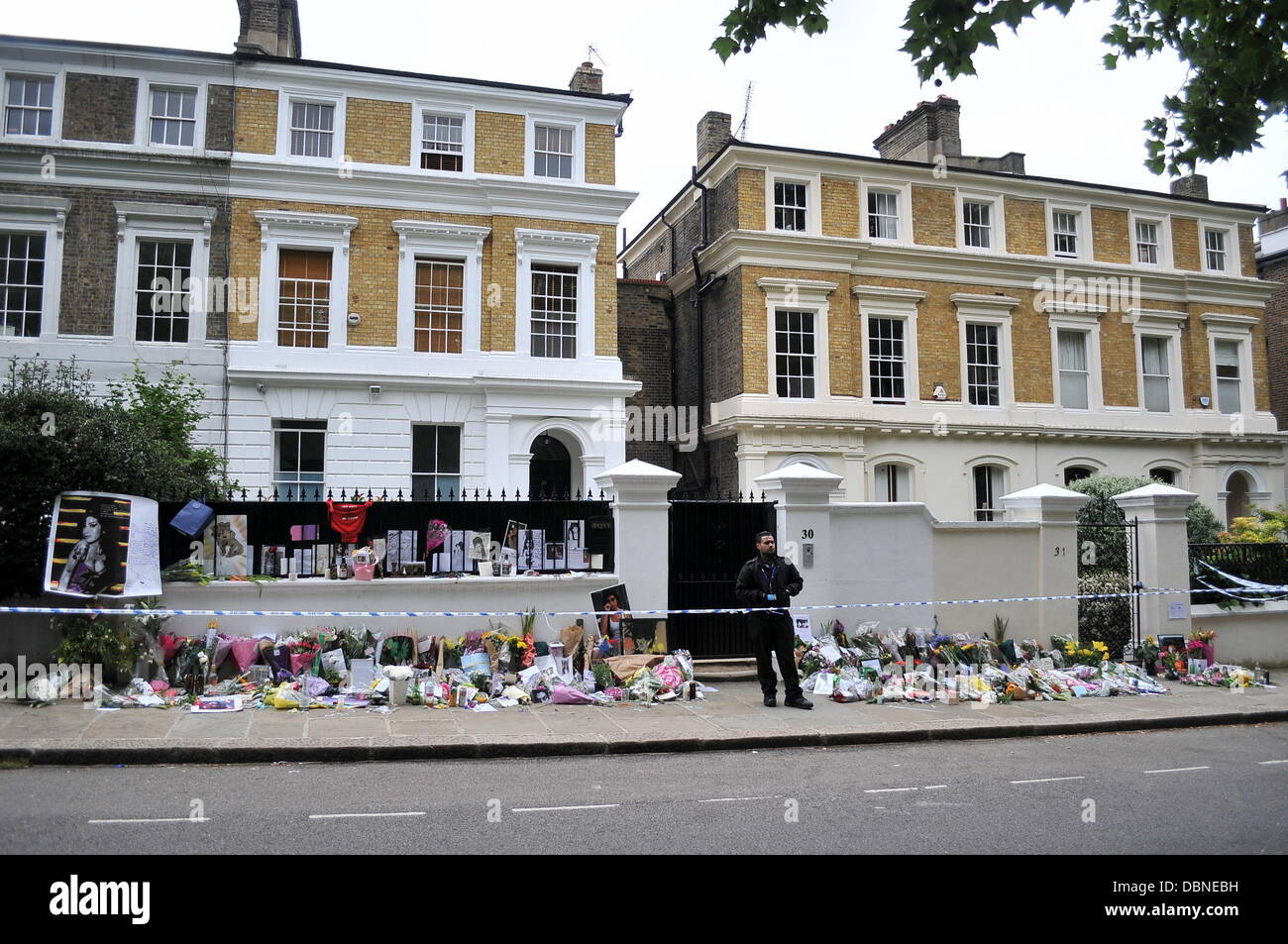 Tributes outside the house of Amy Winehouse following her death London