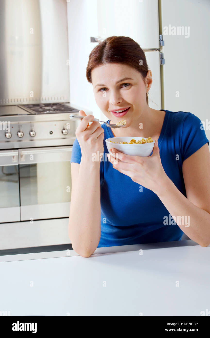 woman eating cereal with milk Stock Photo Alamy