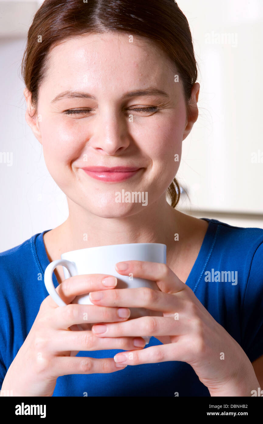 woman drinking a cup of tea Stock Photo - Alamy