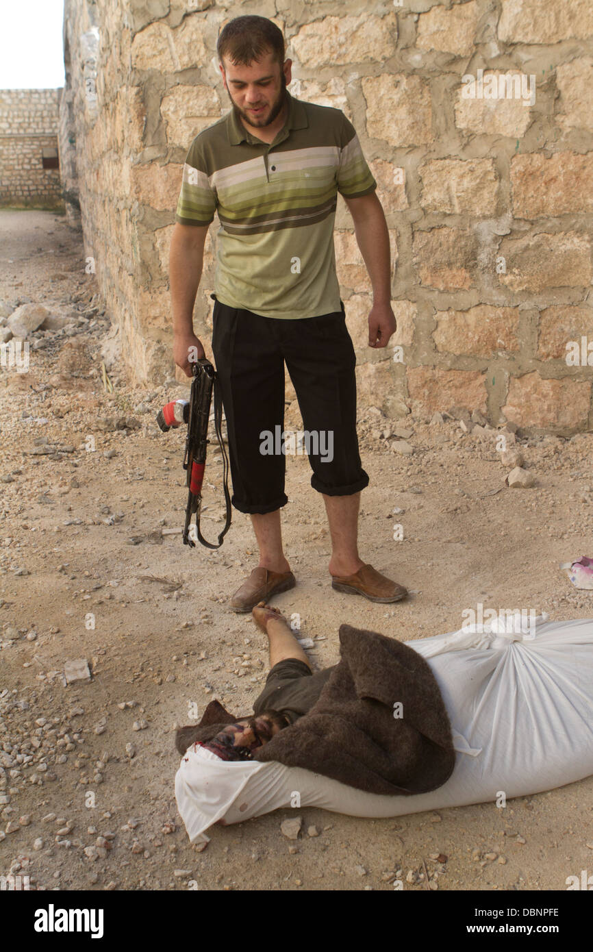 Aleppo, Syria: A dead government fighter that was killed in battle lies near the frontline in Al Aziza. Stock Photo