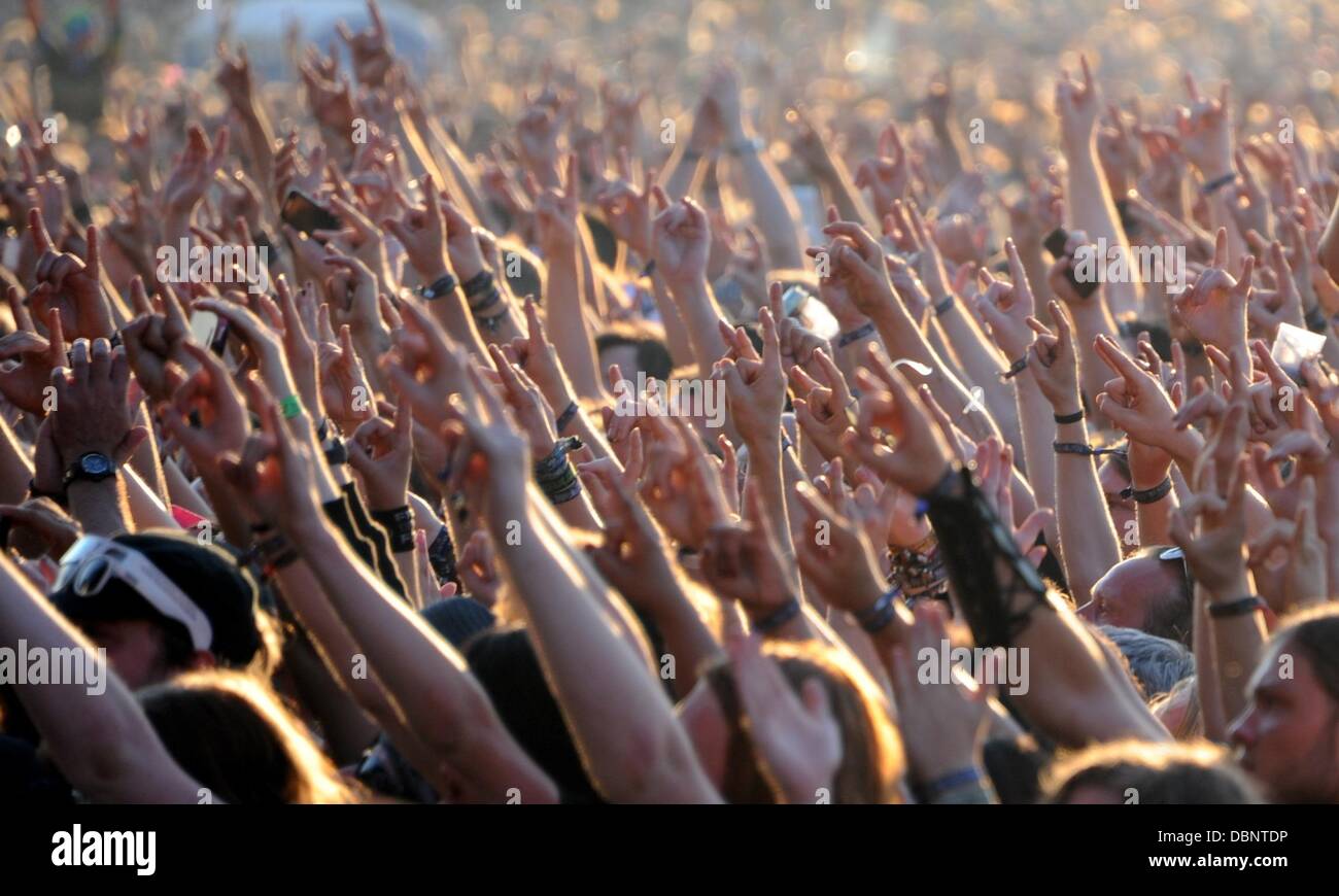 Wacken, Germany. 01st Aug, 2013. Fans celebrate during a concert of Deep Purple at Wacken Open Air Festival in Wacken, Germany, 01 August 2013. Around 75,000 visitors celebrate at the 24th Wacken Open Air Festival, which according to the organizers is the world's biggest heavy metal festival. Photo: Carsten Rehder/dpa/Alamy Live News Stock Photo