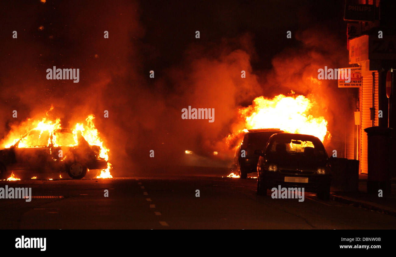 Cars set on fire after rioters go on rampage in Toxteth, Liverpool Police and fire crews were stretched to the limit after a third night of riots and looting across Greater London and parts of the UK following the shooting of Mark Duggan by police in Tott Stock Photo