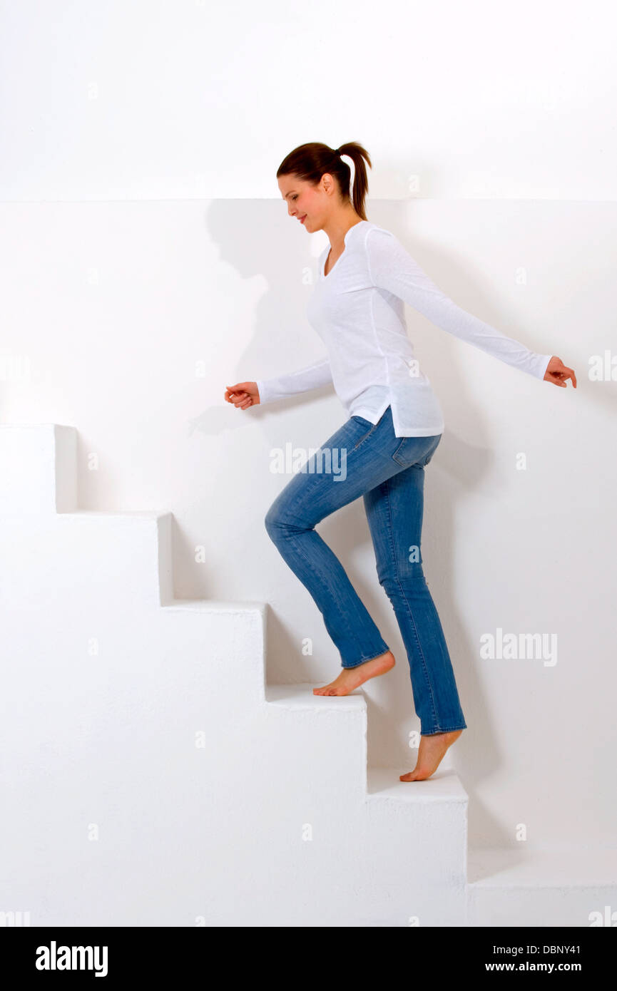 woman climbing the stairs Stock Photo Alamy