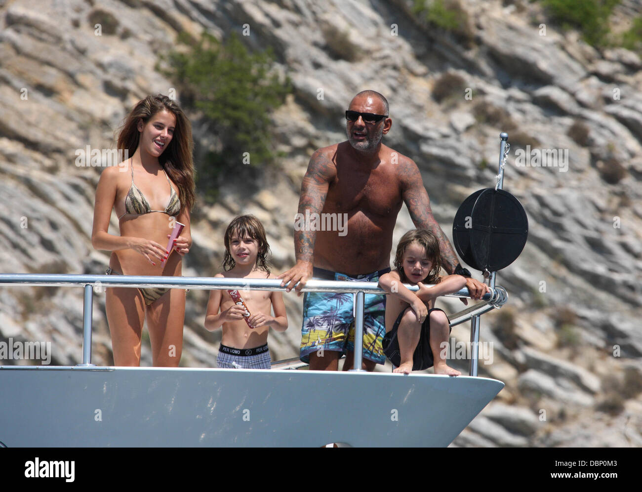 Christian Audigier with his sons and girlfriend Nathalie Sorensen  vacationing on Audigier's private yacht Ibiza, Spain - 31.07.11 Stock Photo  - Alamy
