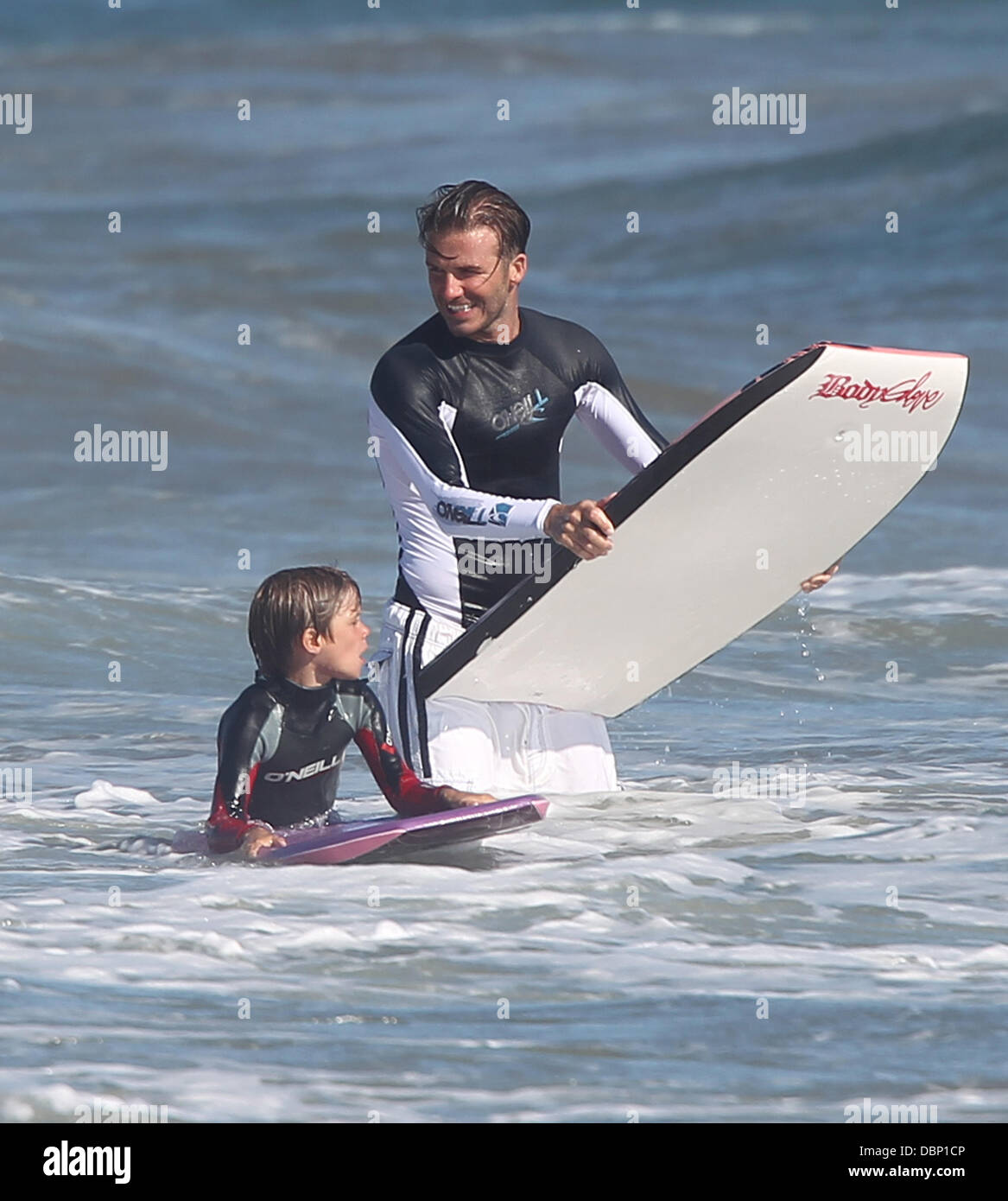 David Beckham bodyboarding with his son Romeo on Malibu Beach Los