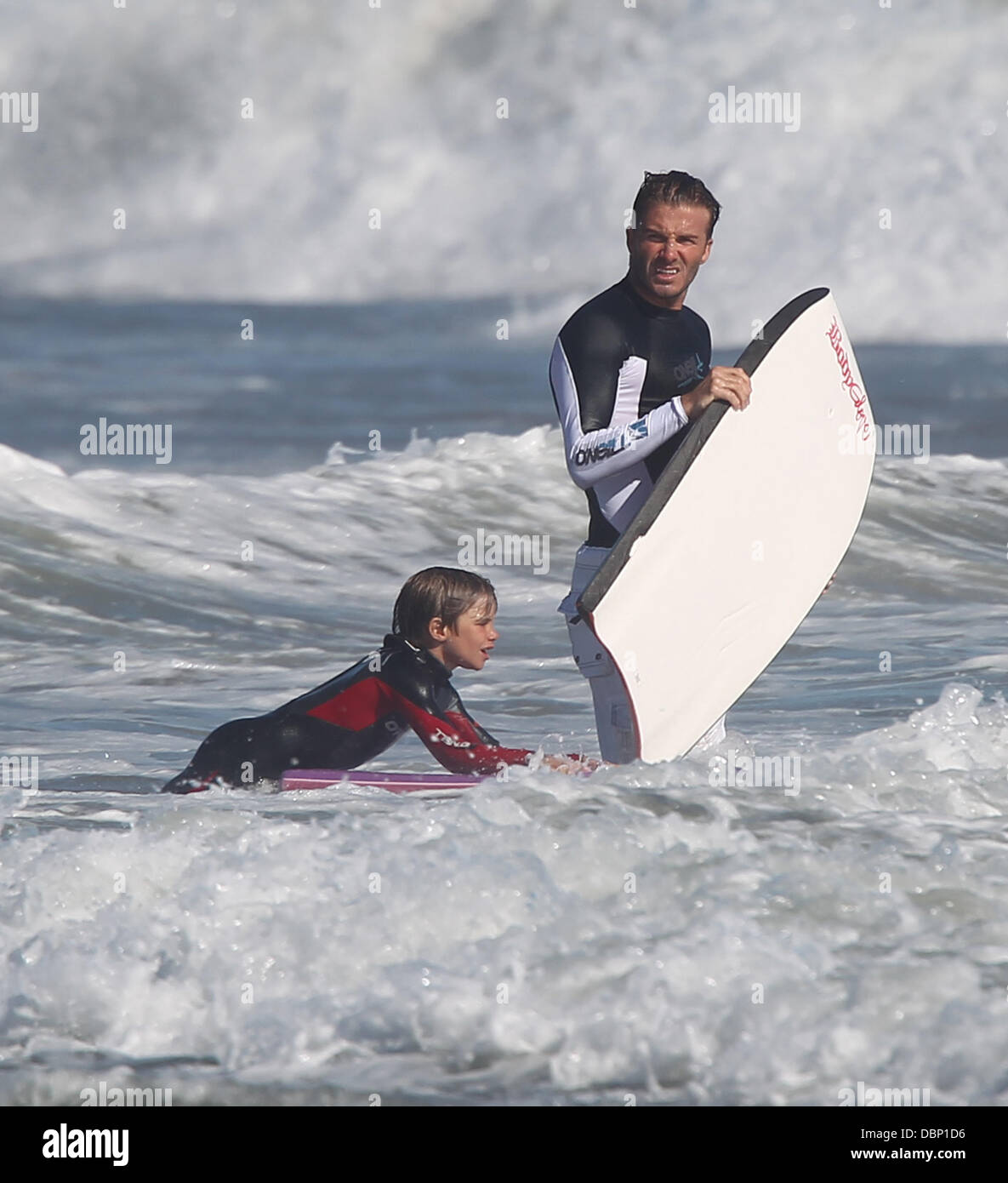 David Beckham bodyboarding with his son Romeo on Malibu Beach Los
