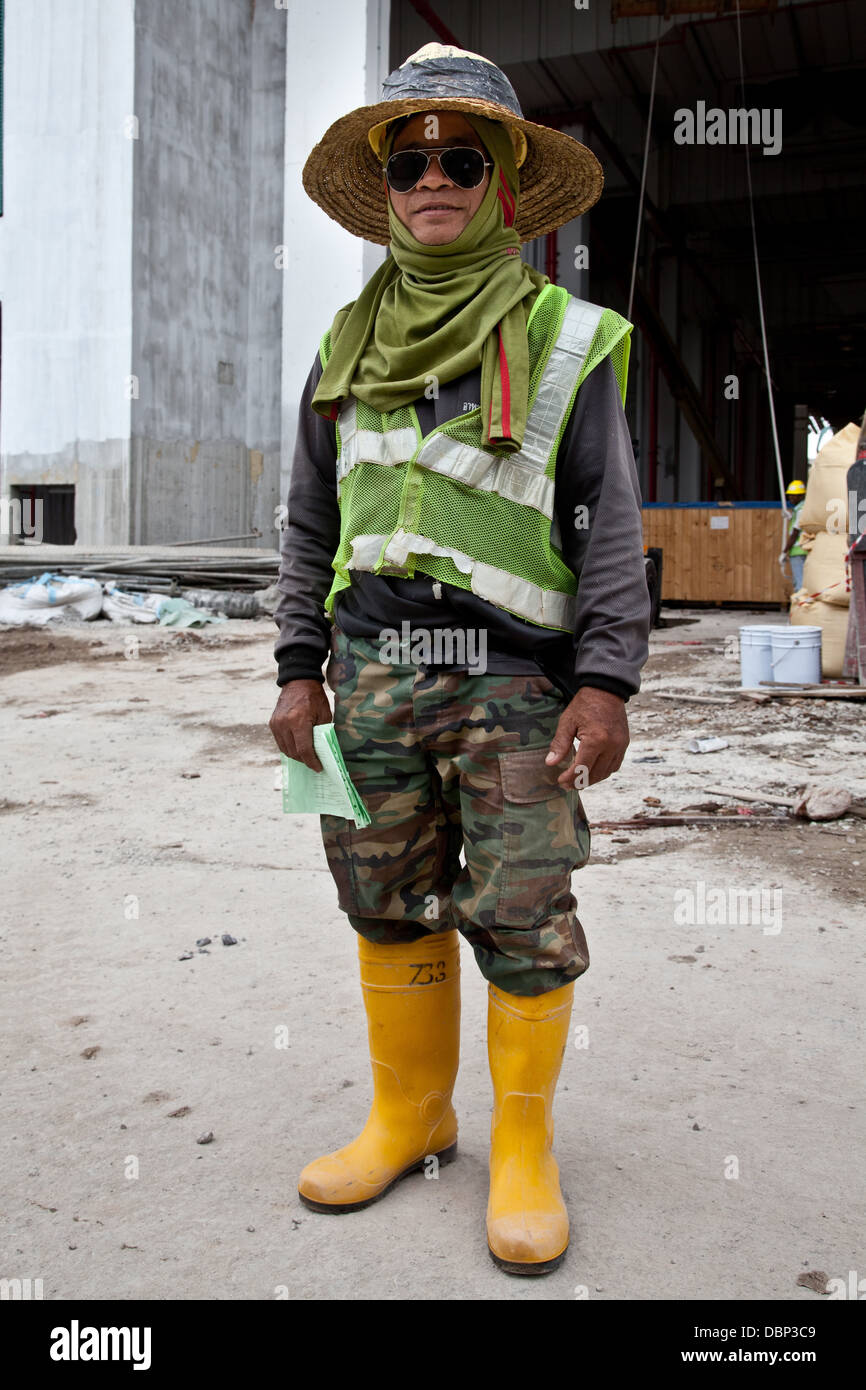 Chinese construction worker hi vis clothing Stock Photo
