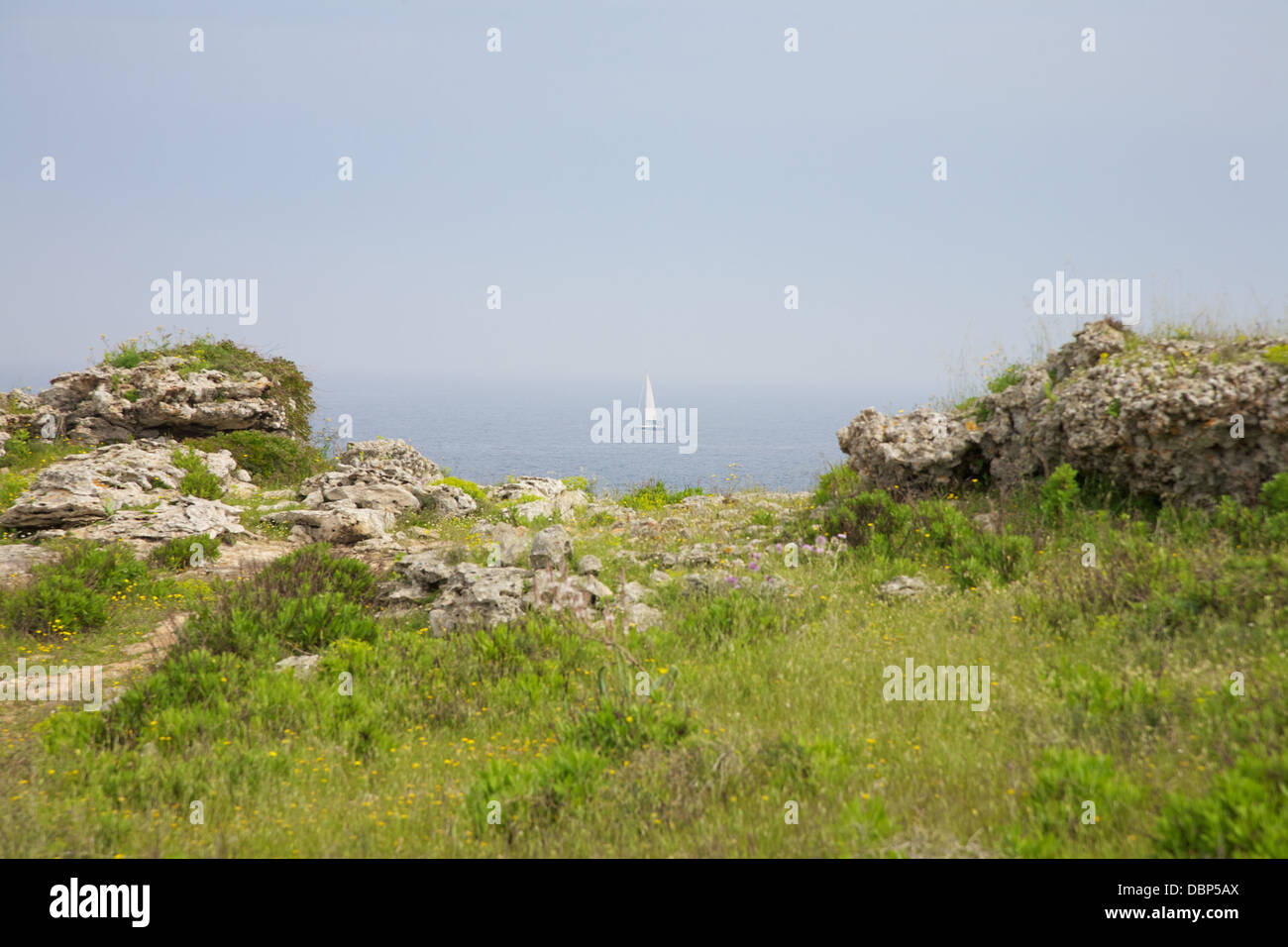 sailing between rocks Stock Photo - Alamy