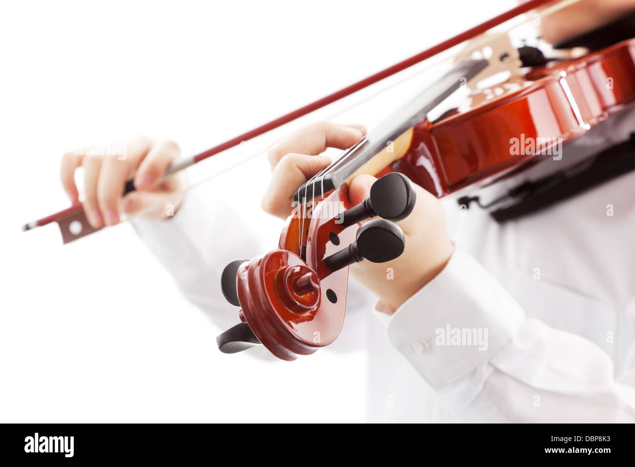 Teenager playing the violin, white background Stock Photo