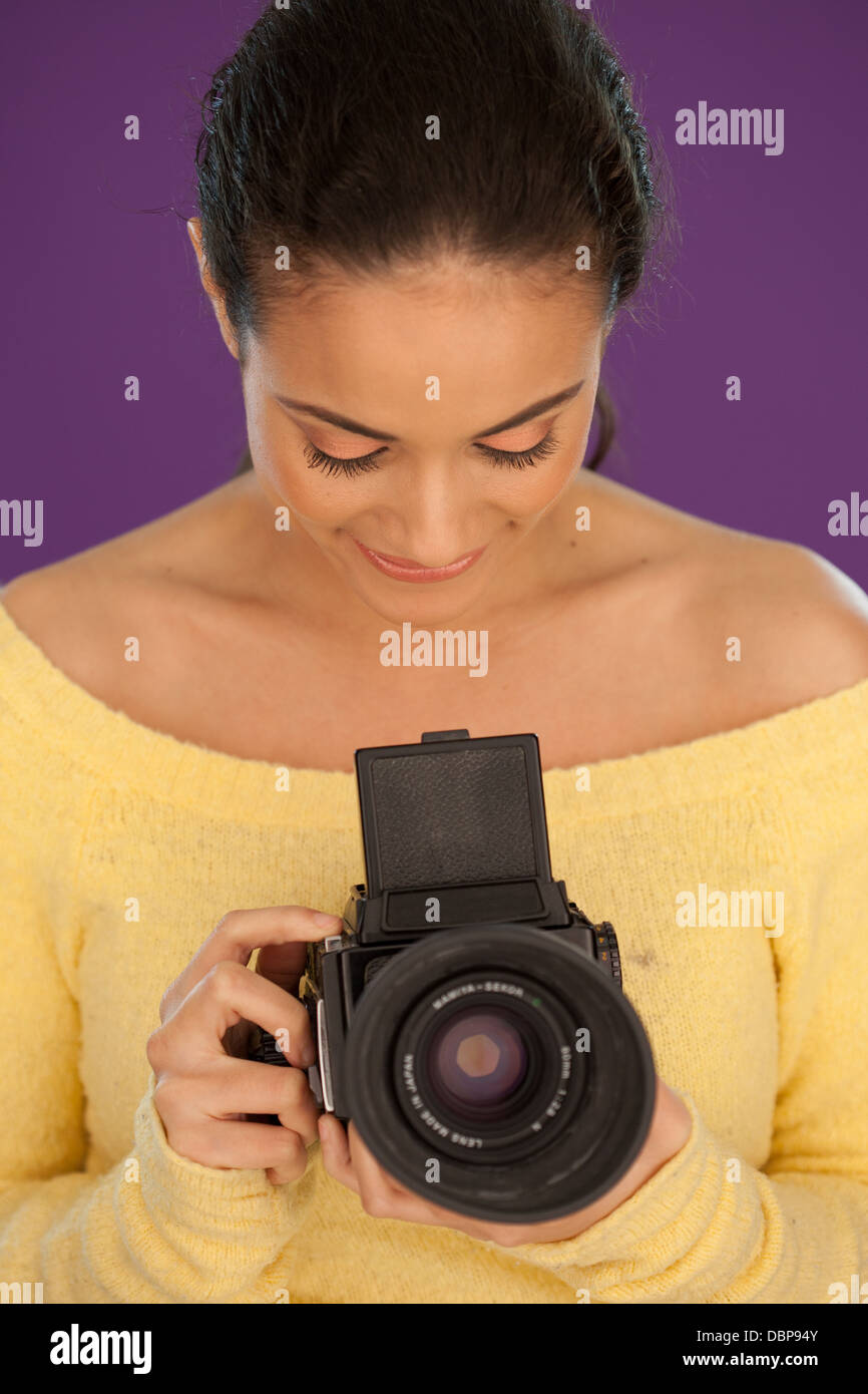 Woman using vintage box camera Stock Photo - Alamy