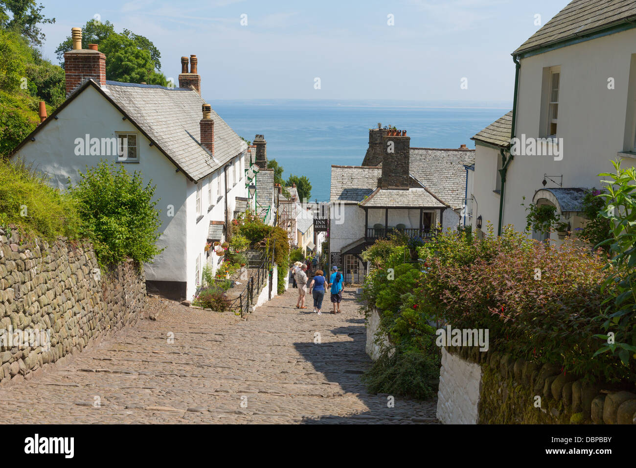 Clovelly street Devon England UK beautiful coast village and port, steep walk down to harbour on cobbled streets Stock Photo