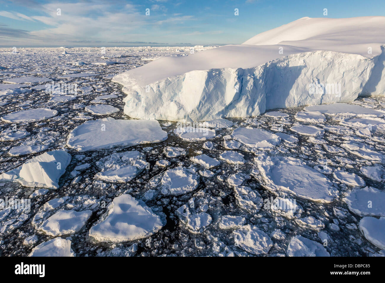 Sea ice mixed with brash ice near Pleneau Island, western side of the Antarctic Peninsula, Southern Ocean, Polar Regions Stock Photo