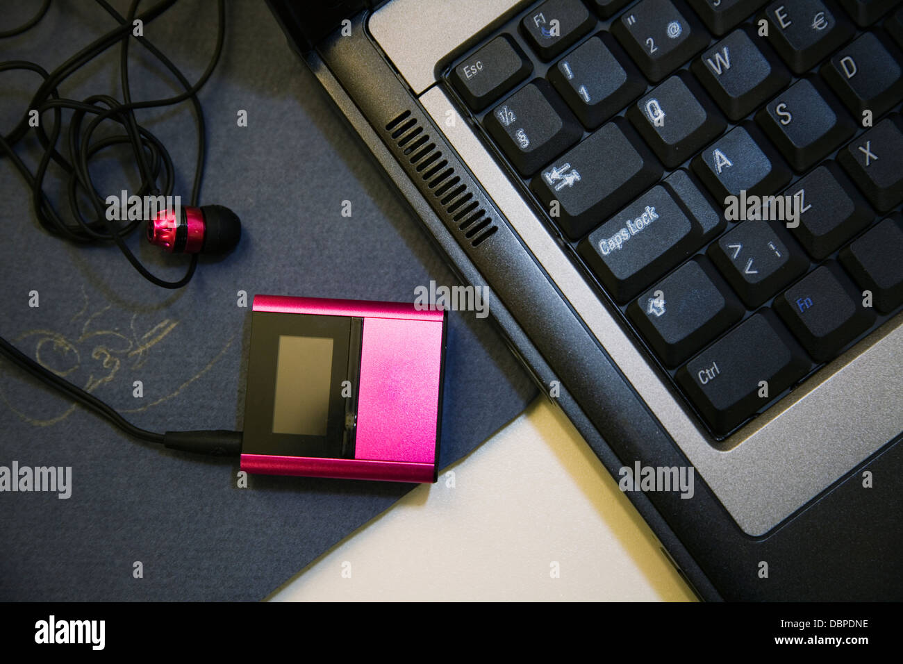 Mp3 player and laptop Stock Photo Alamy