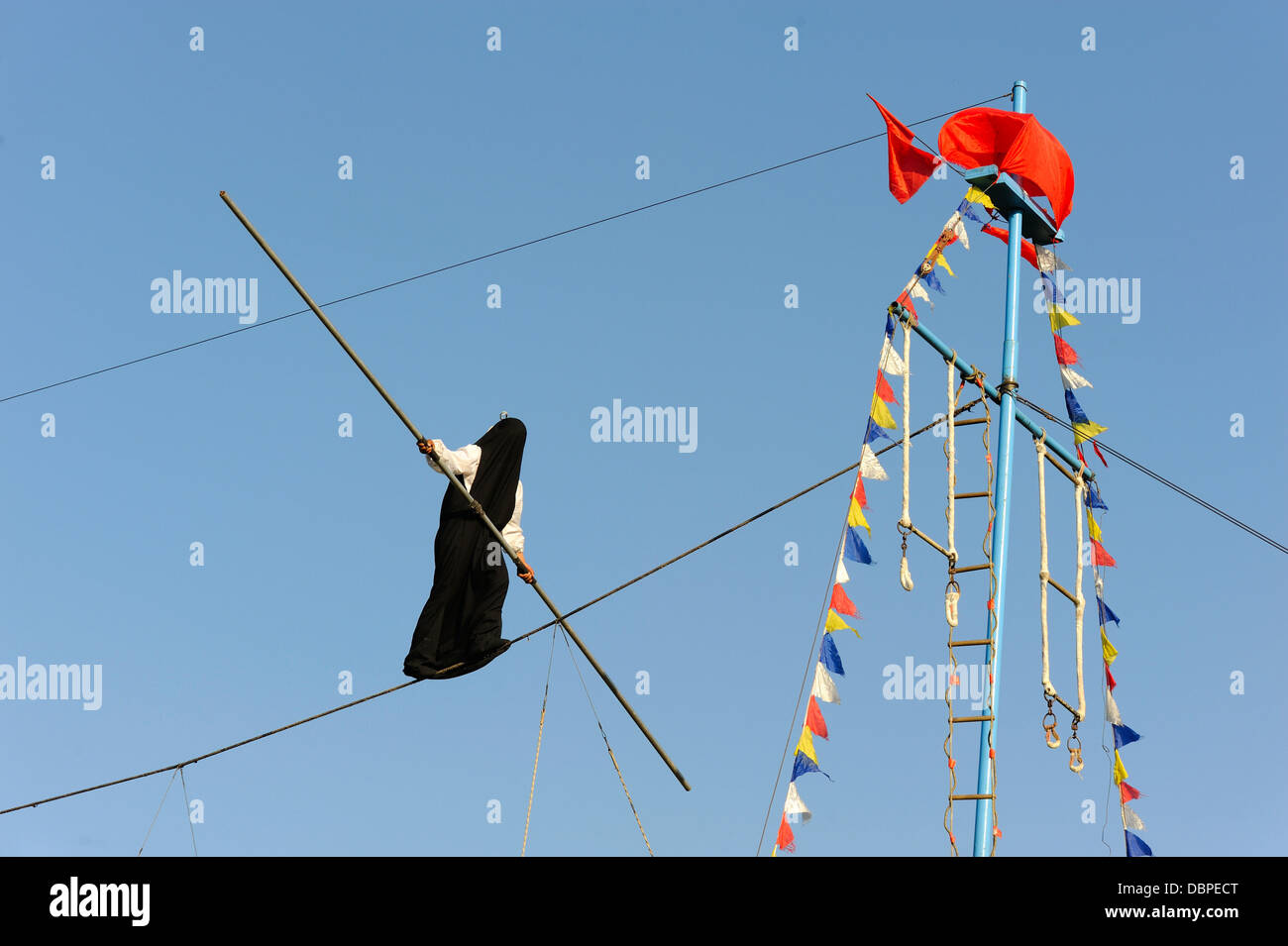 Ropedancer's performance in a black bag Stock Photo Alamy