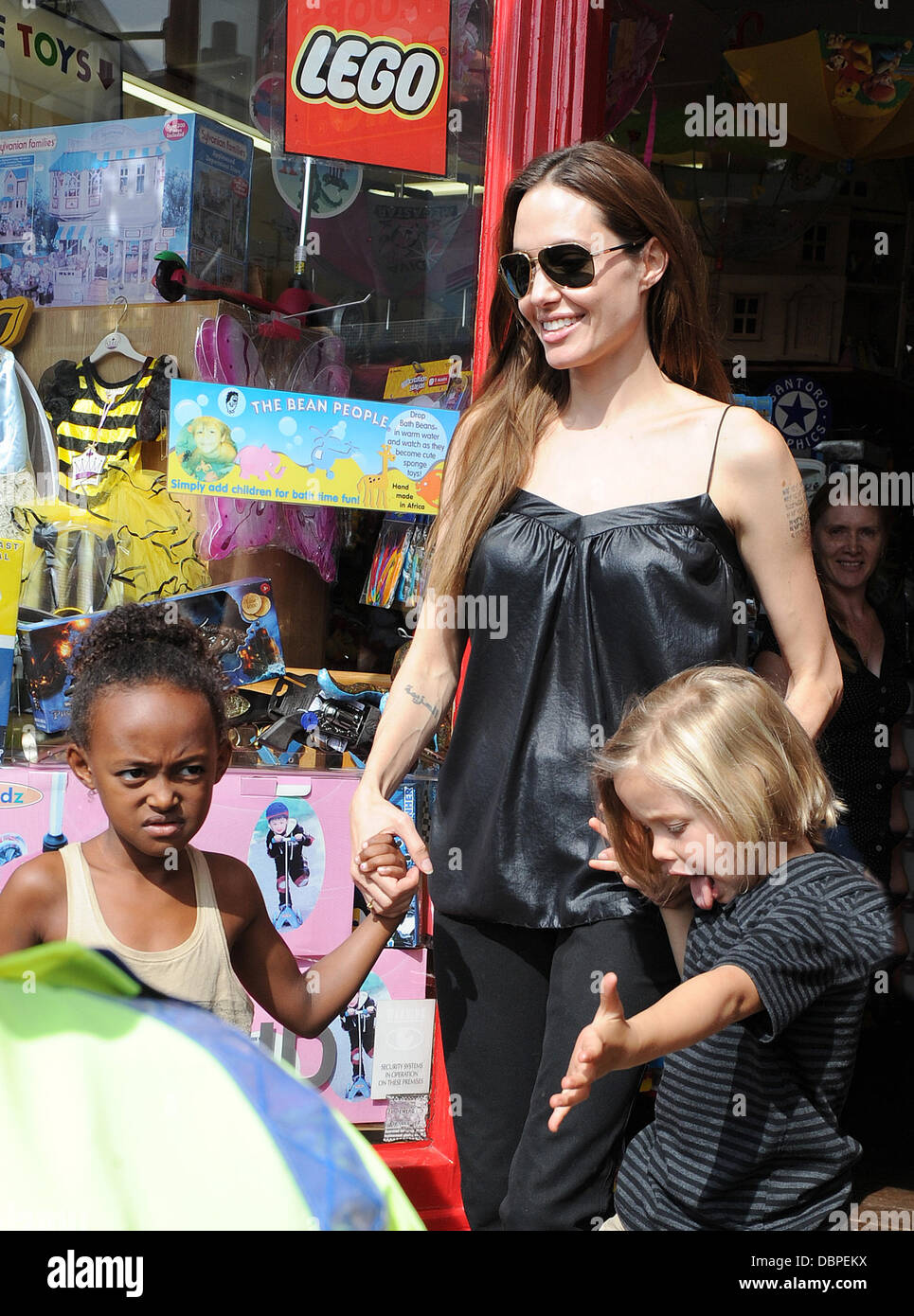 Angelina Jolie and daughters Zahara Jolie-Pitt and Shiloh Nouvel Jolie-Pitt leaving the Toy Station Richmond, Surrey - 15.08.11 Stock Photo