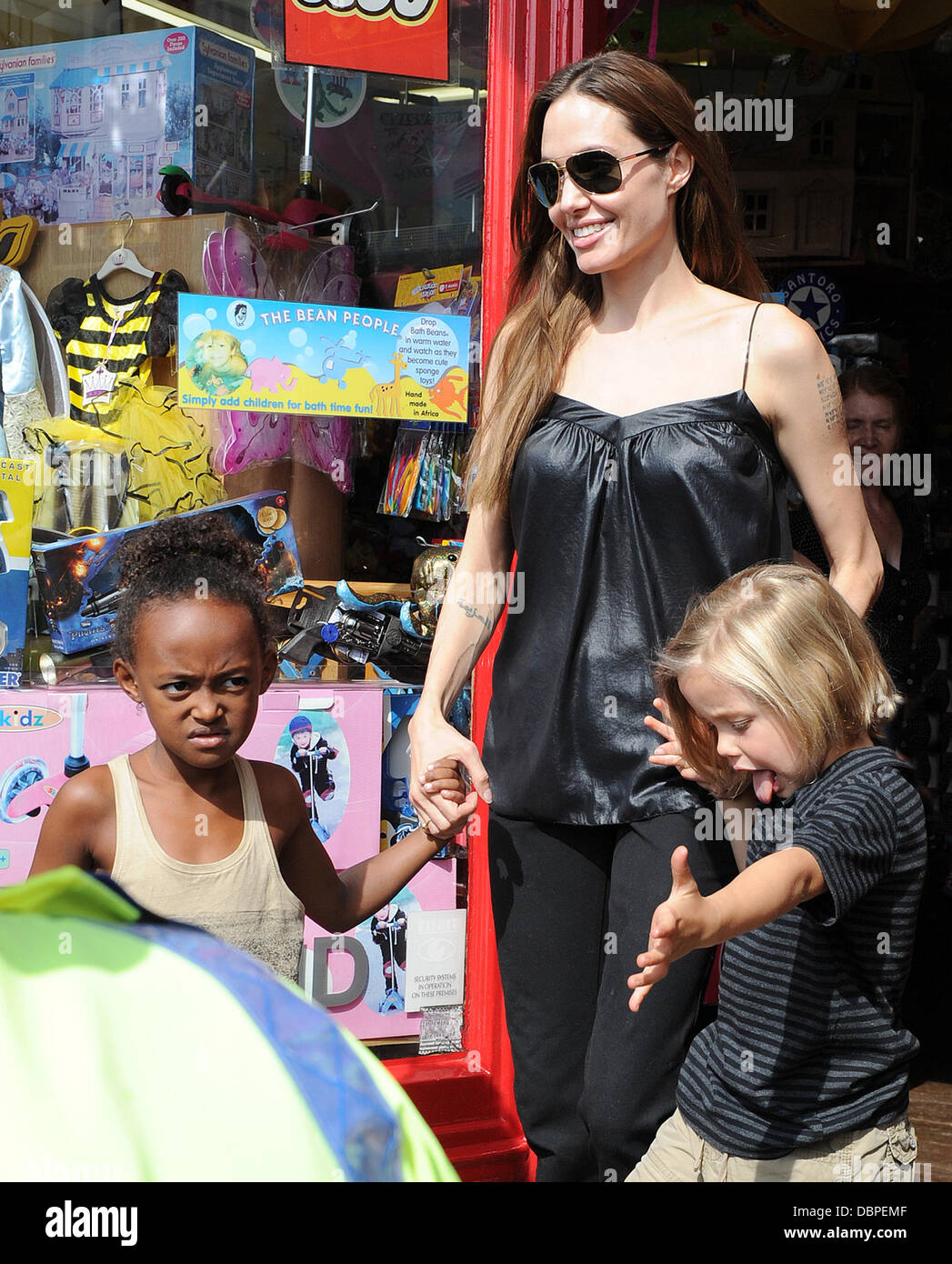Angelina Jolie and daughters Zahara Jolie-Pitt and Shiloh Nouvel Jolie-Pitt leaving the Toy Station Richmond, Surrey - 15.08.11 Stock Photo