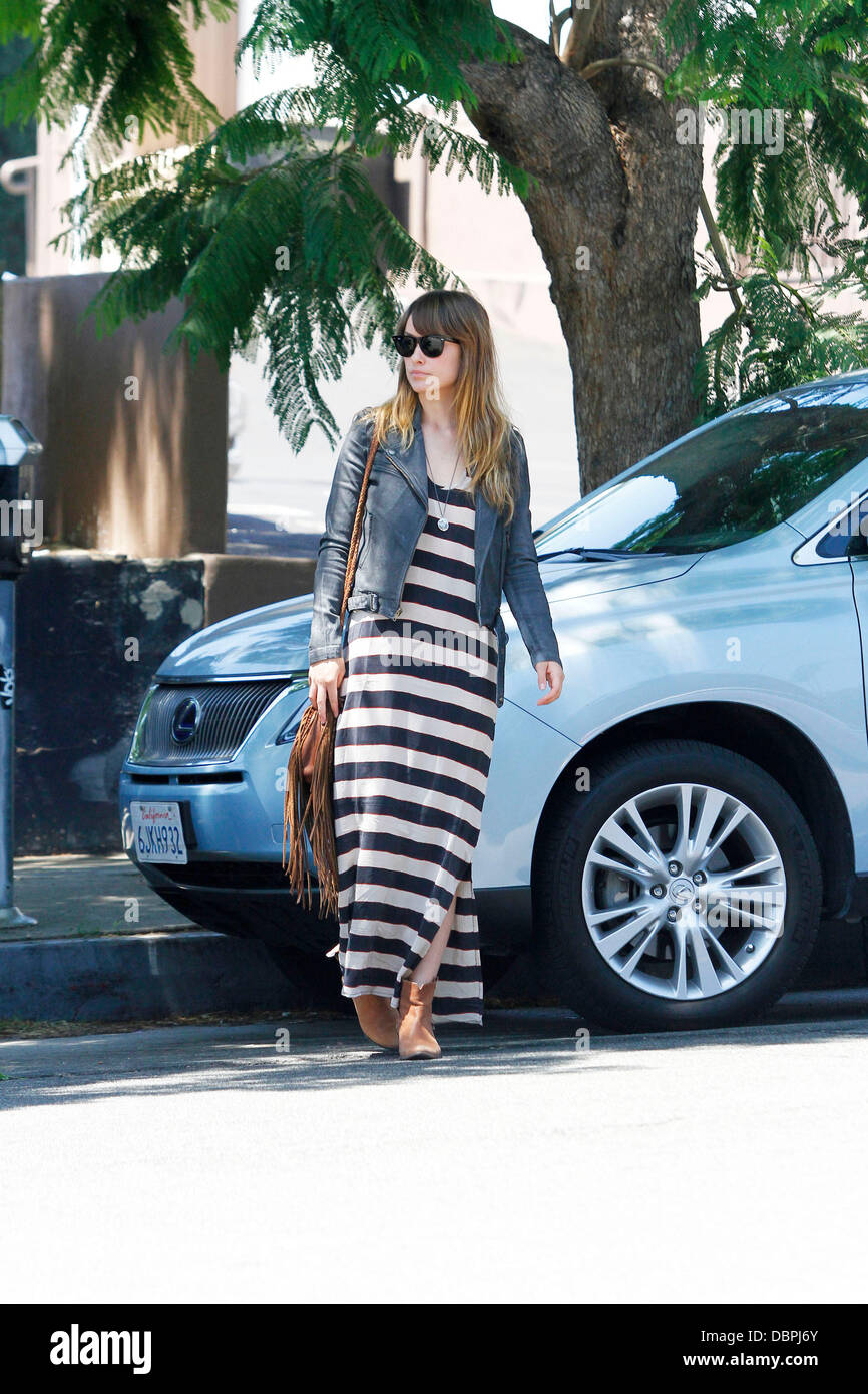 Olivia Wilde arrives for lunch at Little Dom's Cafe in Los Feliz. The  actress looked very stylish in a denim jacket, striped maxi-dress and  accompanied with a tasseled tan leather satchel Los