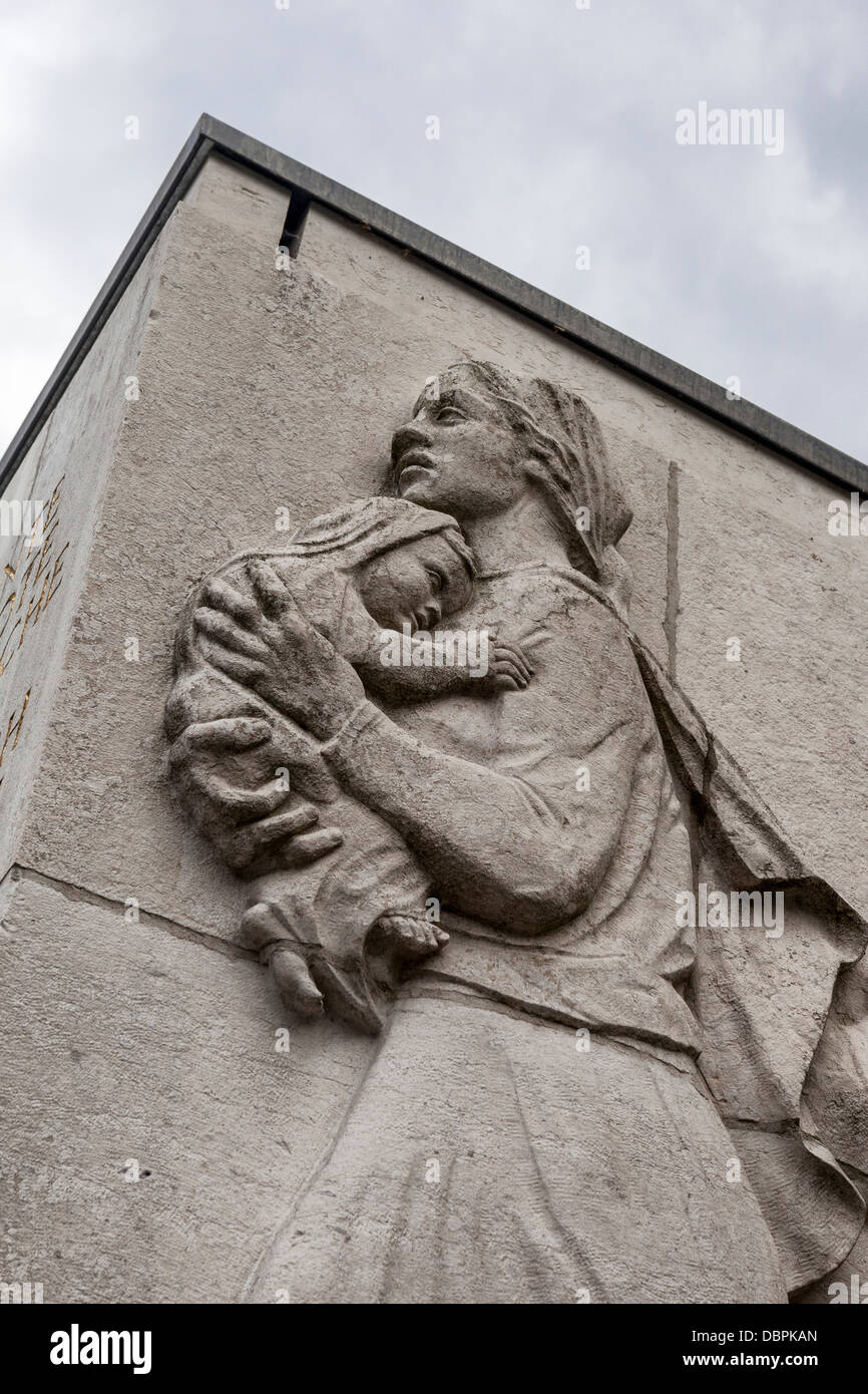 Sculpture of woman and child on sarcophagus at the Soviet War memorial for 5000 soldiers who died in WW2, Treptow, Berlin Stock Photo