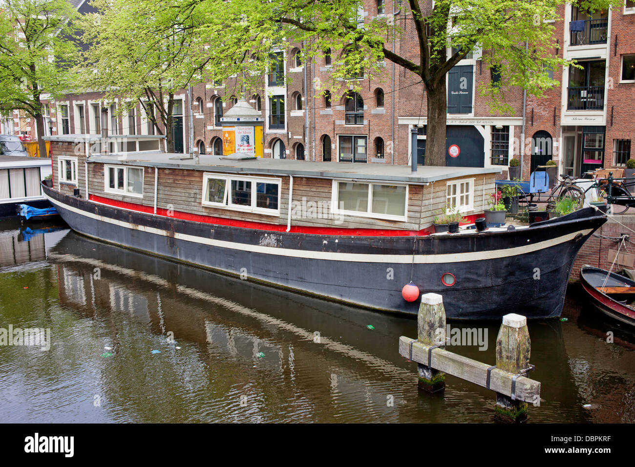 Barge houseboat on a canal in Amsterdam, Netherlands Stock Photo Alamy