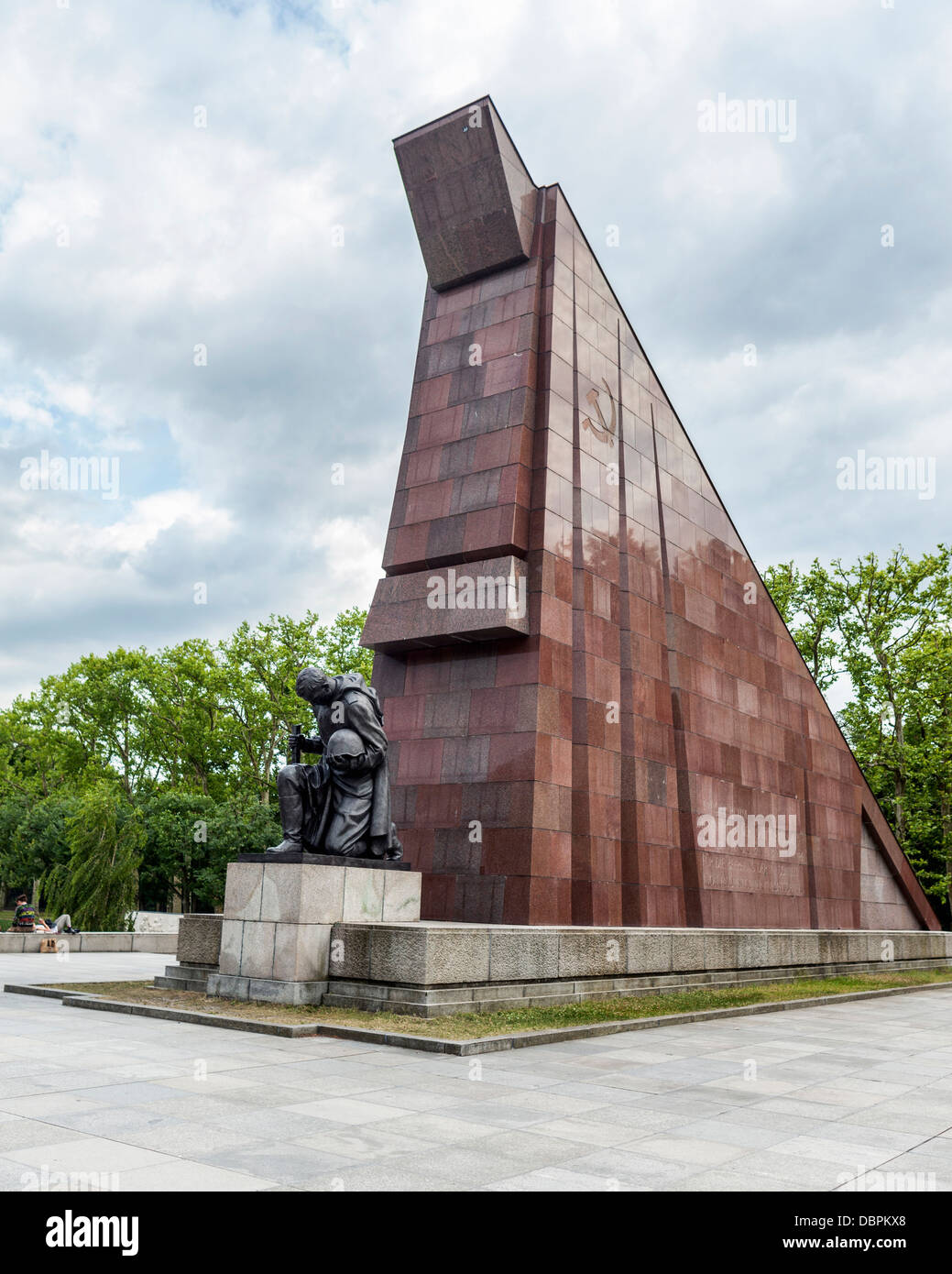 Abstract Granite flag & soldier sculpture with bowed head at the Soviet War memorial for 7000 soldiers who died in WW2, Treptower Park, Berlin,Germany Stock Photo