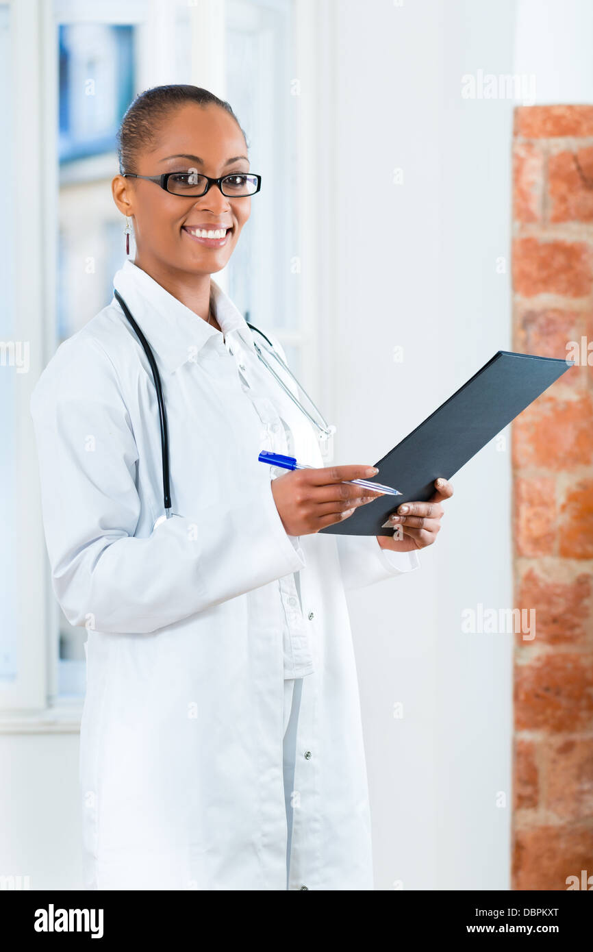 Latina female doctor standing hi-res stock photography and images - Alamy