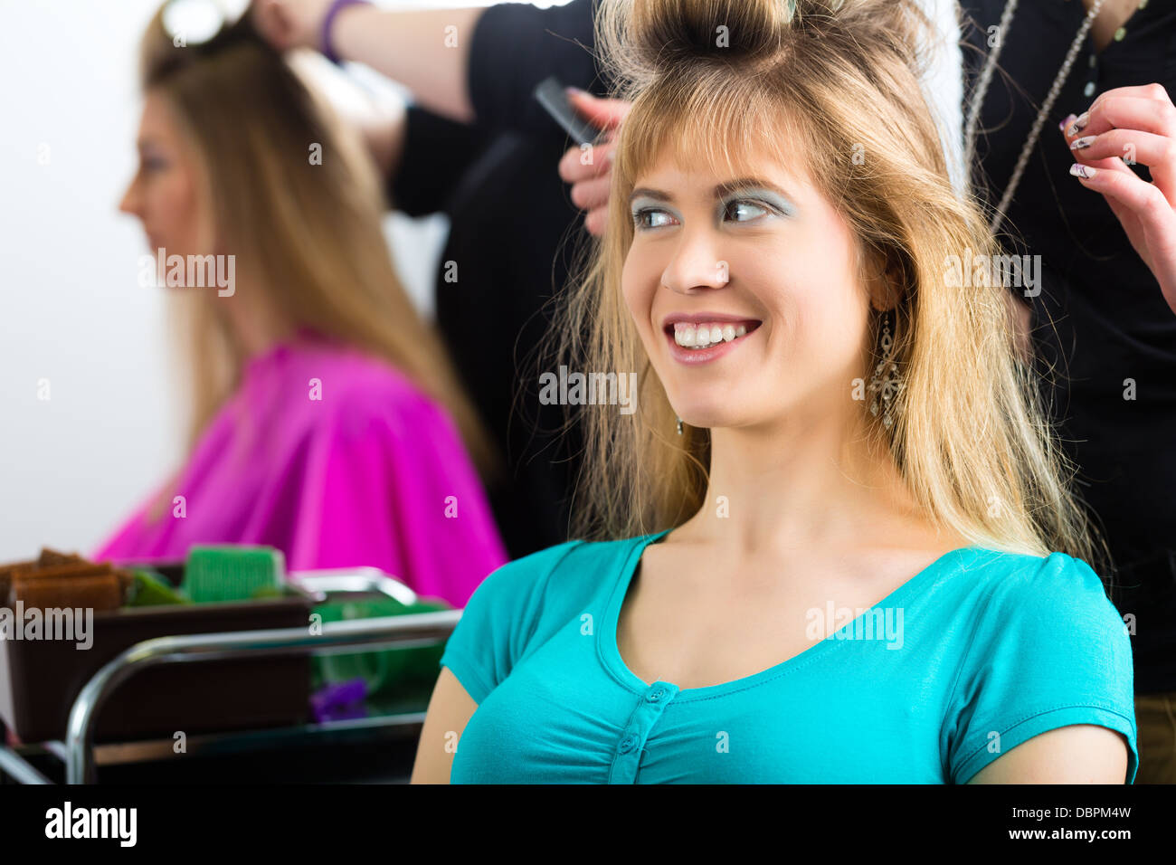 Hair stylist curling customer hi-res stock photography and images - Alamy