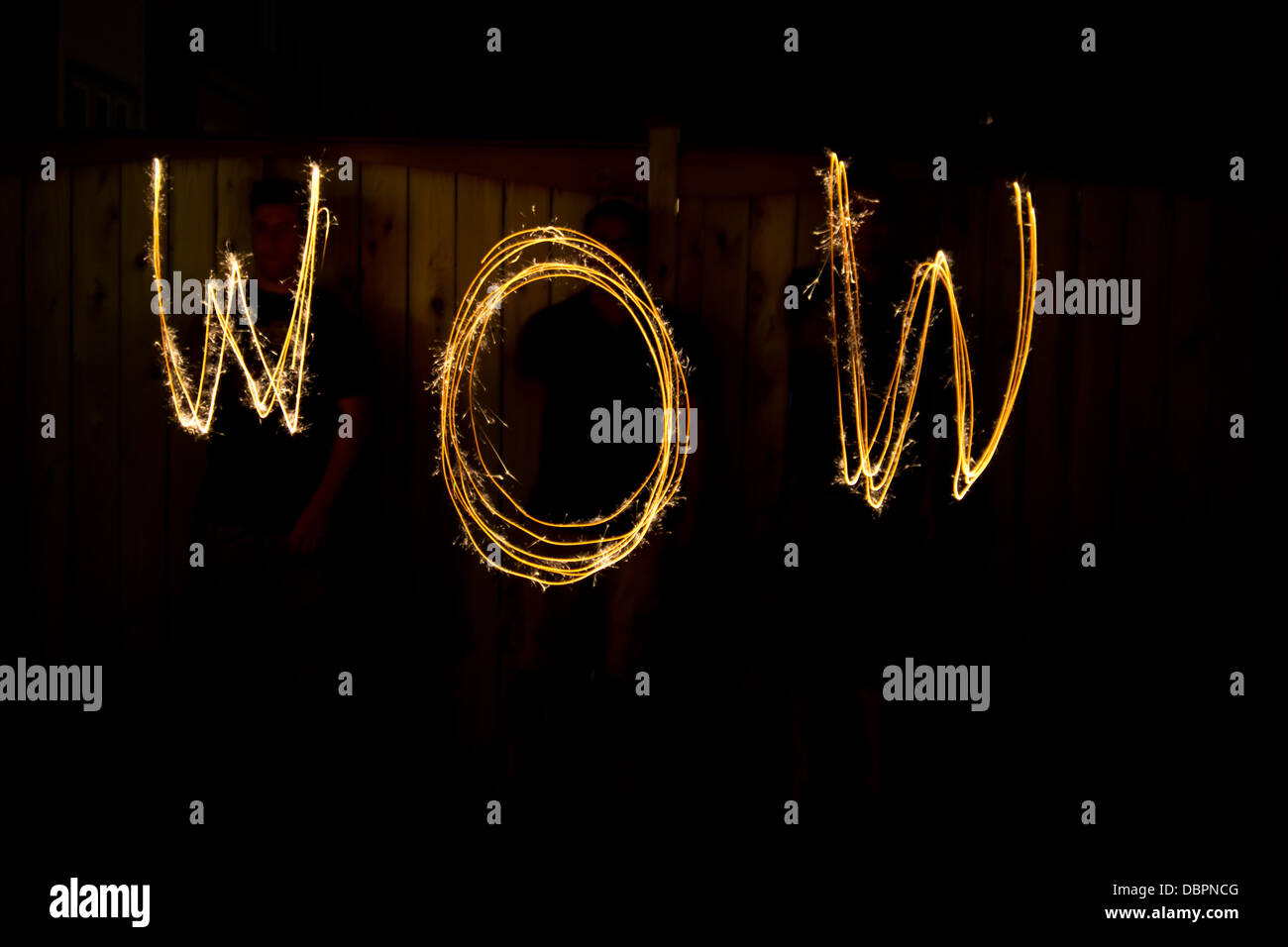 The word Wow in sparklers time lapse photography Stock Photo