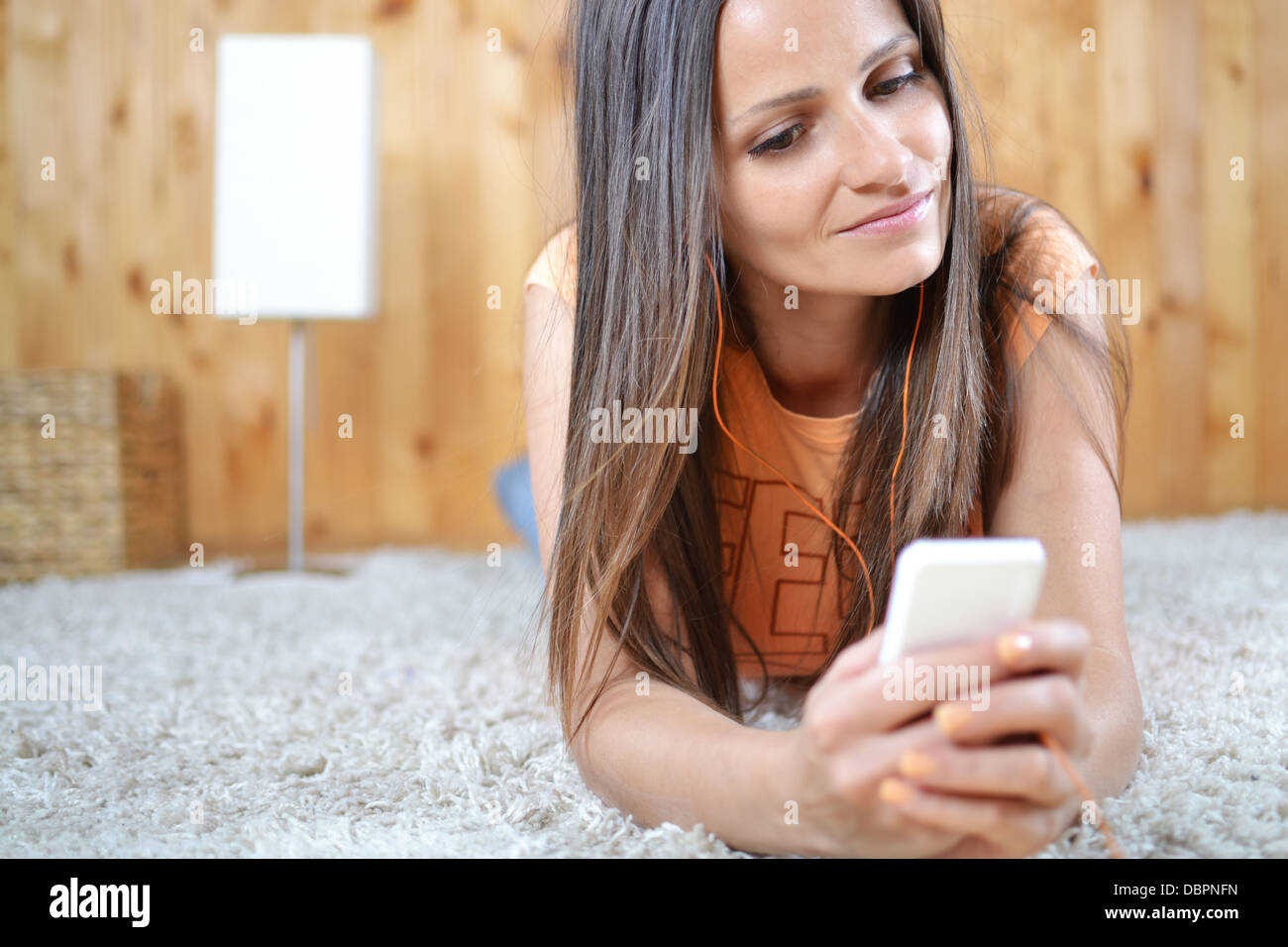 A young woman listening music in her room Stock Photo - Alamy