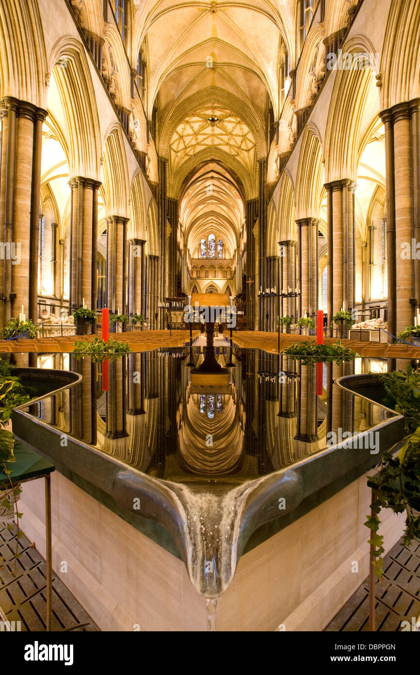 Interior of Salisbury Cathedral reflected in font Stock Photo