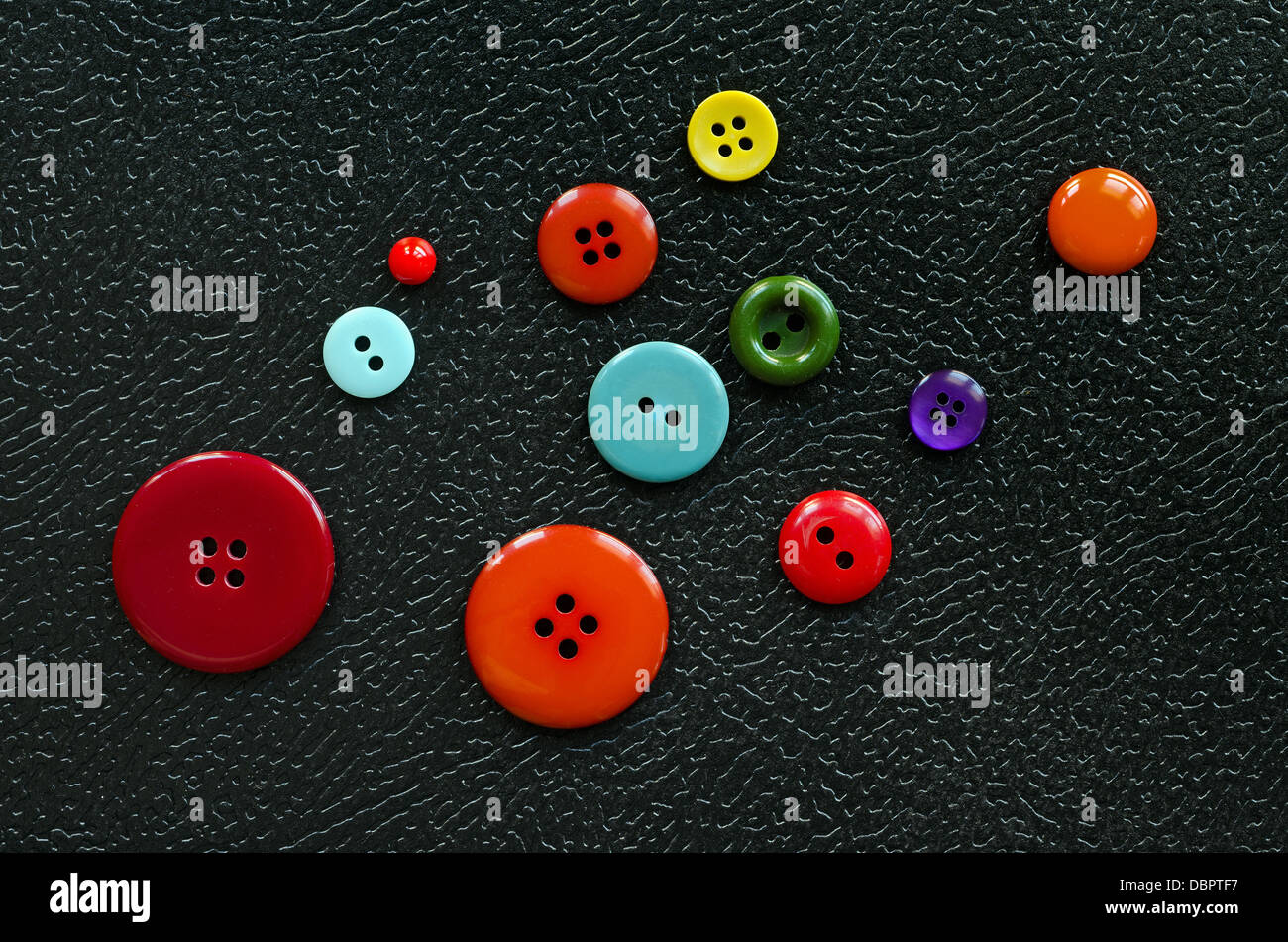 buttons on black background Stock Photo - Alamy