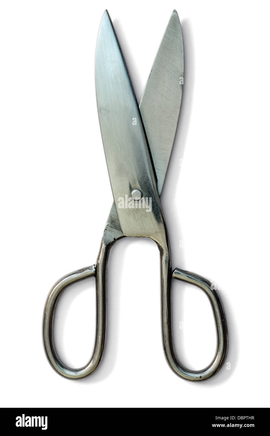 A pair of old handle scissors, open. over gray background Stock Photo