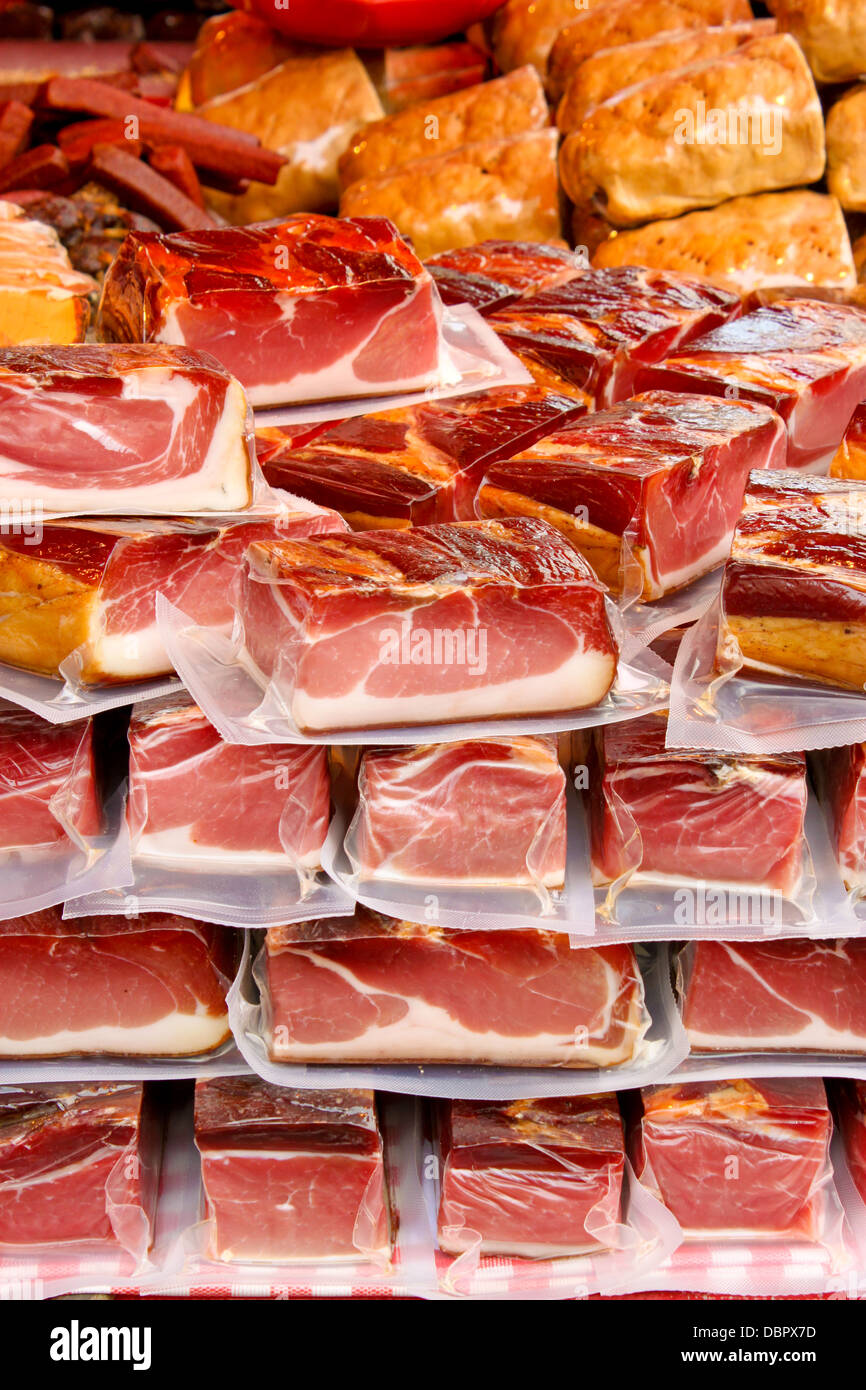 vacuum packed pieces of meat on a farmers market Stock Photo