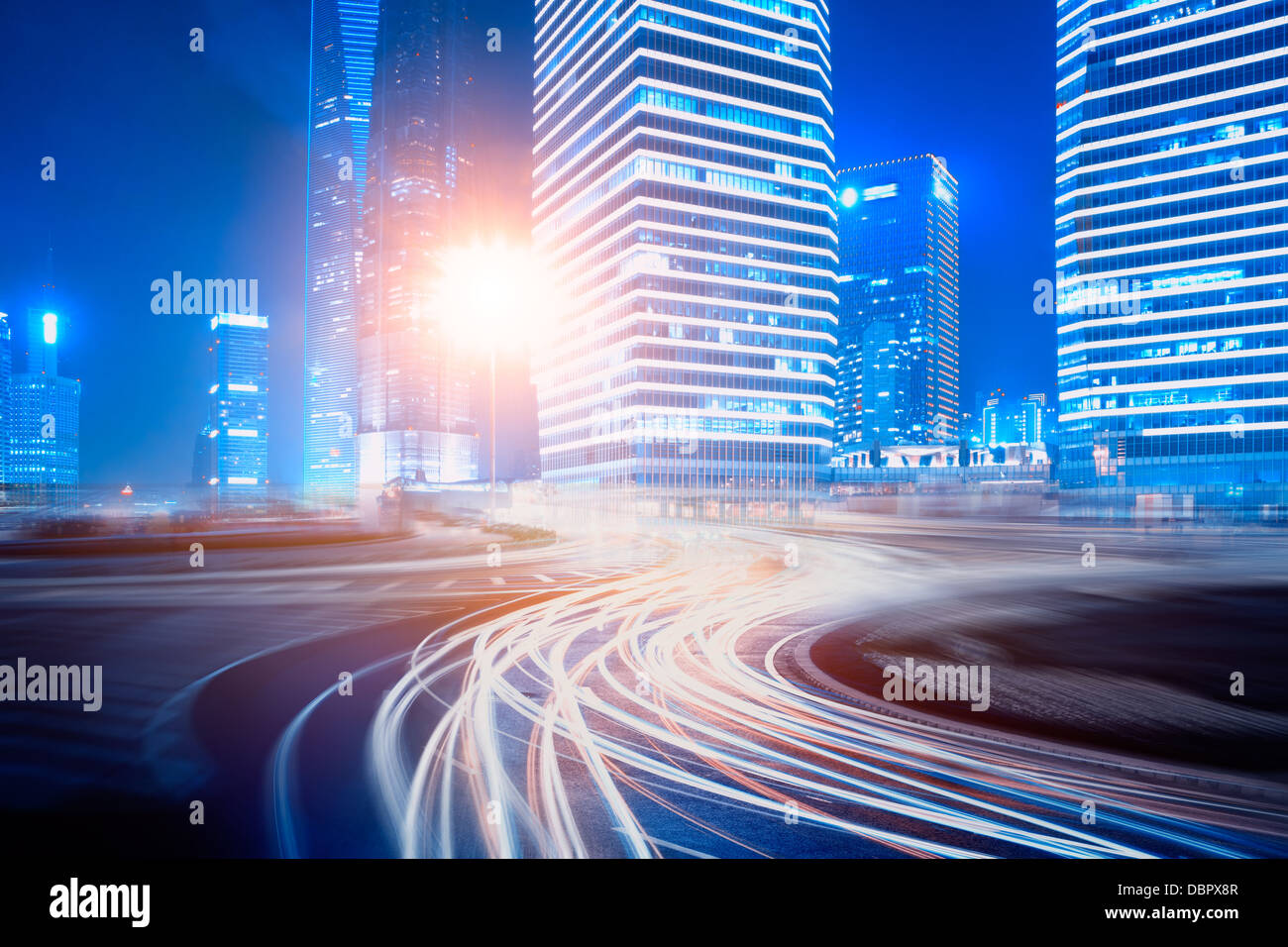 light trails on the street with modern building background in shanghai ...